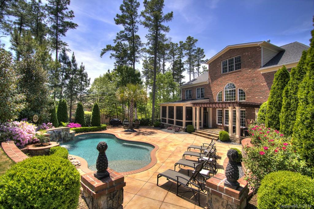 This home is truly an OASIS!  Shows like a model!  Hardwood floors throughout most of the house.  Granite countertops, cherry cabinets, brand NEW carpet in secondary bedrooms, NEW cooktop to be installed May 10th, built-in wine fridge and butler's pantry, the owners retreat and closet are AWESOME!  New in 2010 - screened-in porch with gas fireplace, flagstone flooring, pergola, pool with waterfall, lavish landscaping creating a truly private PARADISE!  Must check out the photos!
