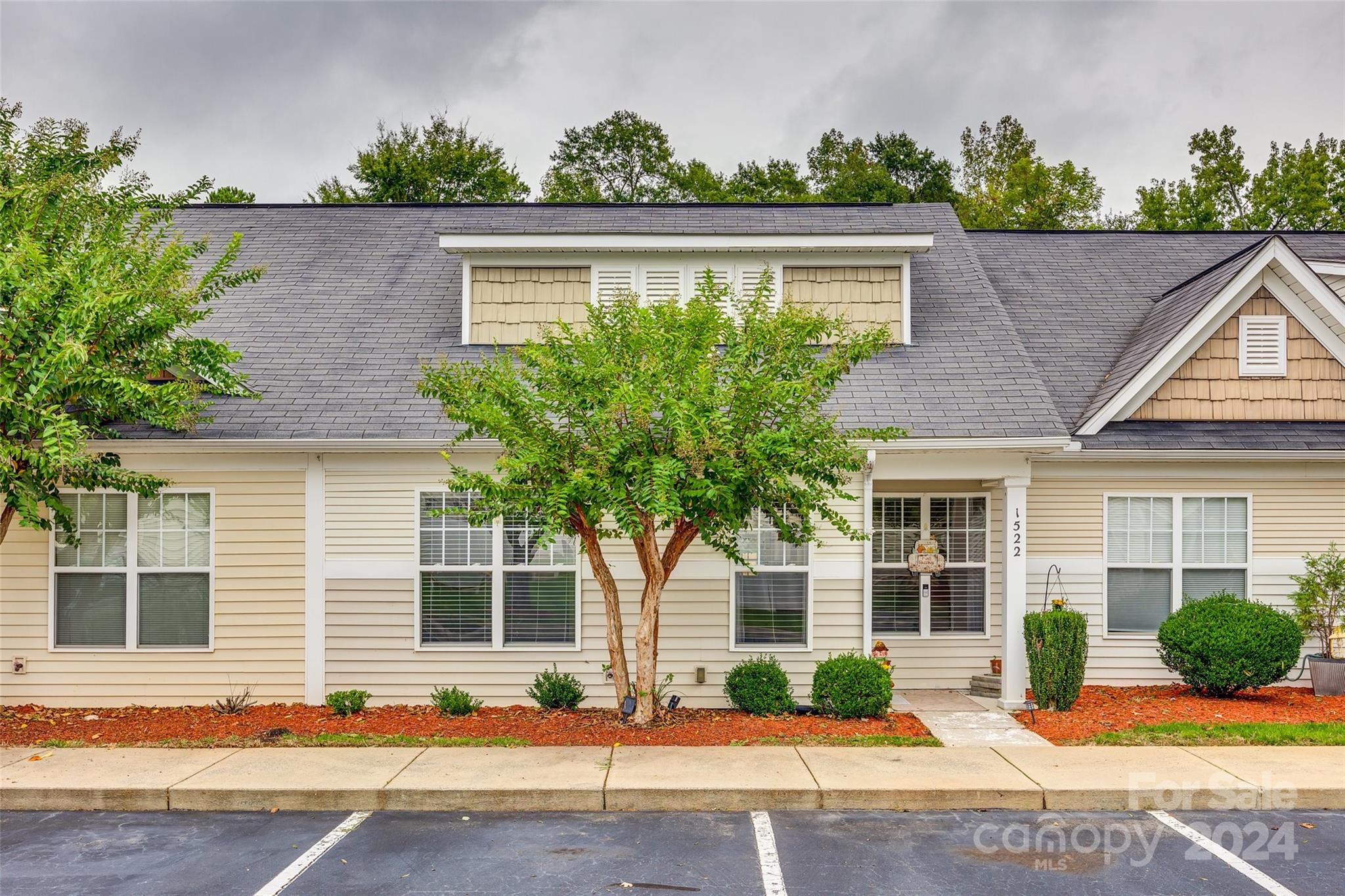 Grab up this gem of a low-maintenance townhouse in this highly sought-after Lake Wylie paradise.  Featuring stylish laminate flooring, a spacious open layout, this place is drenched in natural light. With fresh, updated lighting throughout, its neutral vibe means you can just waltz right in and make it yours. Plus, the bonus room upstairs—with its own bathroom—can easily become your extra cozy bedroom or a private retreat! Enjoy a fenced outdoor area along with a charming wooded backdrop that enhances your privacy and creates the perfect getaway. Take pleasure in the nearby parks and stunning lake, all while being just minutes away from shopping and dining delights! And the cherry on top? Access to the award-winning Clover Schools and LOW SC TAXES!