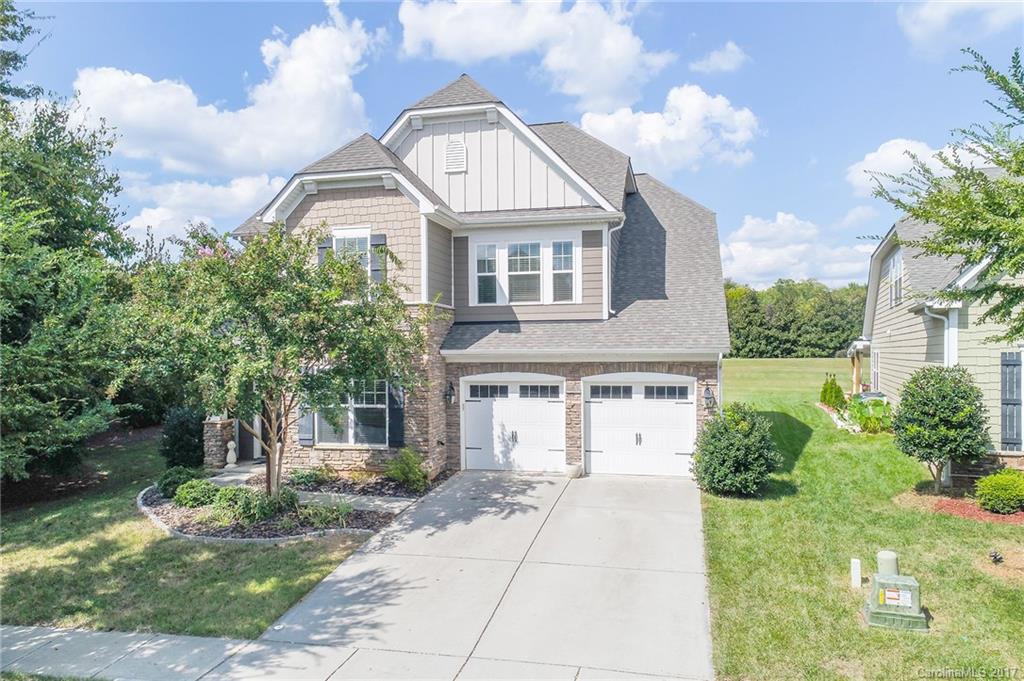 All about the details in this charming 2-story home - added crown molding, drop zone, hardwoods on main, white kitchen and finished garage floor!  Features guest ensuite on main and 4 additional bedrooms, including Master, upstairs.  Main level includes office/study, large living room, formal dining room and breakfast area in open floor plan. Outdoor space includes entertaining area with fire pit and flat lot.