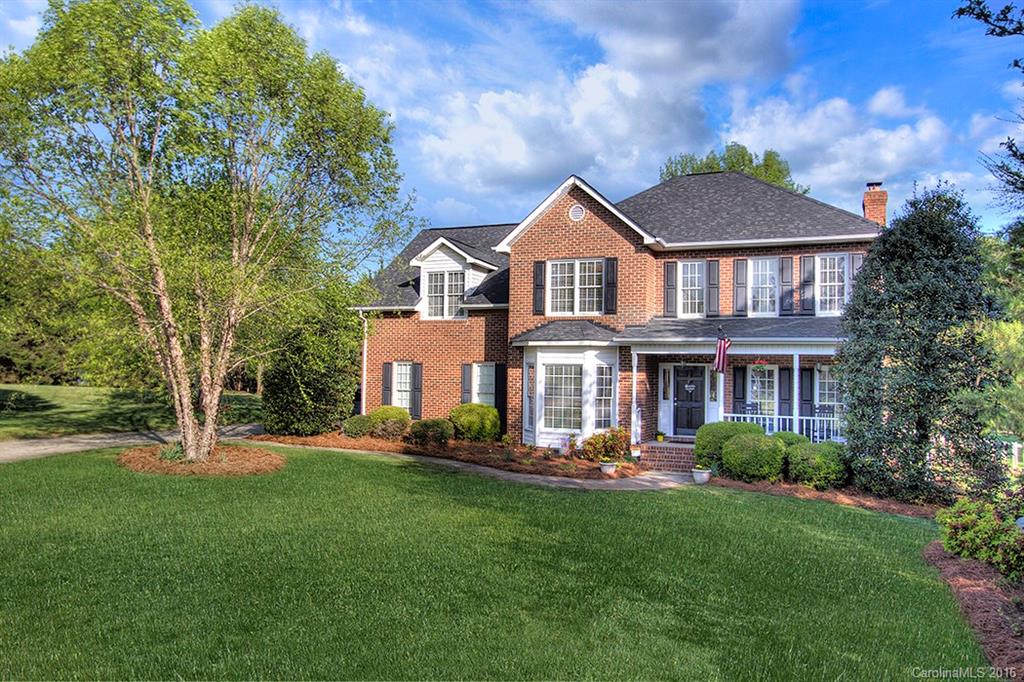 CONTRACT HAS BEEN ACCEPTED BY SELLER - Full brick home on LEVEL, fenced acre lot in desirable Fort Mill school district.  Voluntary HOA! Now that I have your attention..rocking chair front porch invites you into this home that boasts hickory wood floors on first floor (open plan w/ kit open to GR). Sep living/office & formal dining space.  Upstairs has 3 full bedrooms + 4th bedroom/bonus option.  There is an additional room that doesn't have a closet (currently used as a nursery).