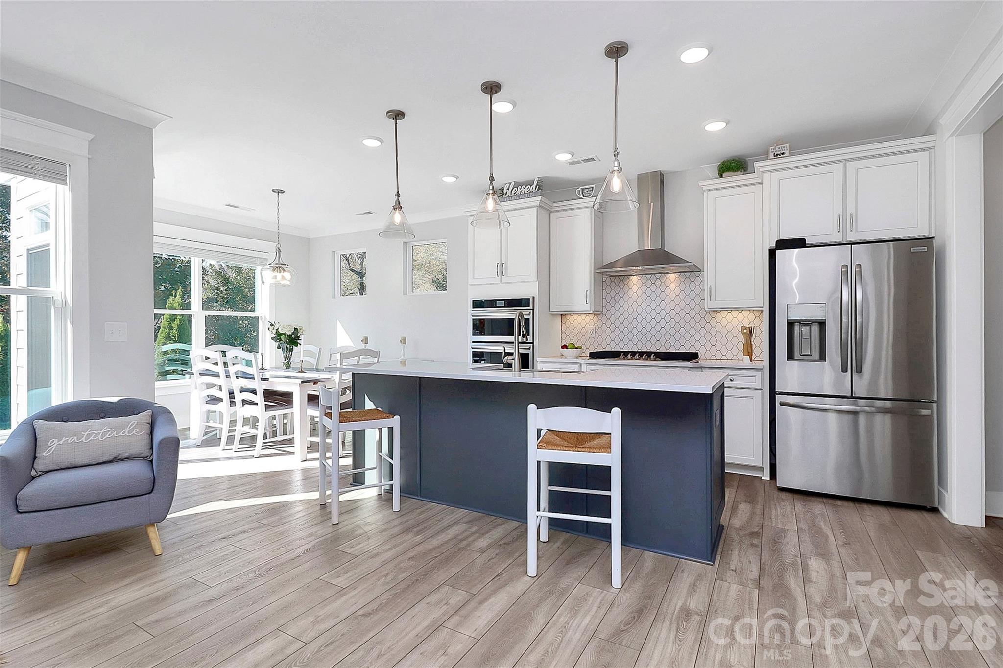Stunning like-new 2022-built home in the desirable McKee Grove community in Charlotte, North Carolina. This beautifully designed two-story traditional home offers 2,248 square feet of modern living space, combining style, comfort, and convenience in one exceptional property. - 

Featuring 4 spacious bedrooms and 3.5 bathrooms, this like-new Charlotte home is ideal for everyday living, entertaining, or relocation buyers seeking a move-in-ready property in a prime location. The open-concept floor plan is enhanced by extensive luxury vinyl plank flooring throughout the main living areas, creating a seamless and upscale feel.

The gourmet kitchen is a standout, complete with a gas range, quartz countertops, tile backsplash, stainless steel appliances, and abundant cabinetry for storage. Just off the kitchen, the inviting living area features a cozy stone fireplace, perfect for relaxing or hosting guests.

Upstairs, the generously sized bedrooms offer comfort and privacy, while the composite stairwell treads add durability and a refined touch. Outside, enjoy a covered front entry and a paver patio ideal for outdoor dining and entertaining. The rear yard has a gentle downslope, and the two-car attached garage with coated flooring plus a concrete driveway provides parking for up to four vehicles.

Built with quality and efficiency in mind, this home includes cement board and stone exterior details, an asphalt shingle roof, aluminum windows, gas heat, a tankless water heater, central air, and Google Fiber availability.
Located just minutes from Pineville-Matthews Road, Weddington Road, and Providence Road, this home offers easy access to top-rated schools, shopping, parks, dining, and recreation. You’ll also love the convenience of being approximately 10 minutes to Ballantyne Bowl and about 30 minutes to Charlotte Douglas International Airport and Uptown Charlotte.

Whether you are relocating from New York, California, or anywhere in the U.S., this move-in-ready home in Charlotte, NC offers the perfect blend of modern finishes, energy-efficient features, and unbeatable location. 

Google Fiber is available