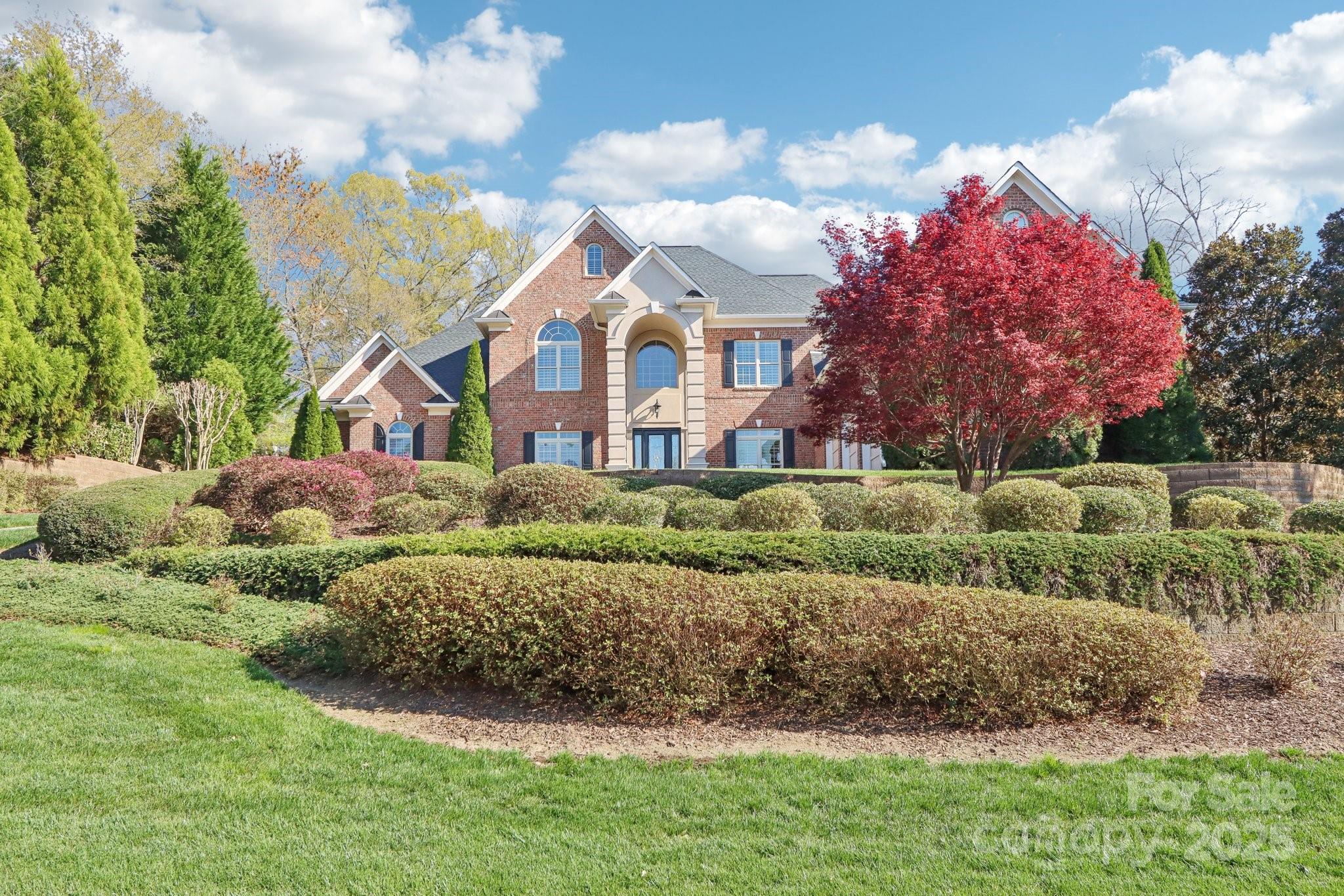 Amazing views of signature hole #15 from this immaculatly maintained home. Fine details include heavy moldings, tall/vaulted/coffered/tray ceilings, 8 ft doors, custom plantation shutters, hydralic elevator, 2 fireplaces, built-in cabinets & surround sound. Primary bedroom on main w/ sitting area, 2 WIC & glamour bath. 2nd primary bedroom on main. Living rm w/ coffered ceiling, built-in's & gas fp. Great rm w/ vaulted ceiling, built-in's, gas fp & open to kitchen. Chef's kit w/ huge island, quartz & custom cab. 2nd fl w/ media/theater rm w/ built-in's, rec rm w/ wet bar, spacious secondary bedrooms w/ ensuite baths. BSMT w/ 11 ft ceilings & 8 ft doors, exercise rm, billiards rm, game rm w/ cabinets, arcade area, 2nd kitchen, full bath, card rm and 2 unfinished stroage areas (one is perfect to finish for another bed w/ exterior access, perfect for multi-generational living). Updates include roof, 3 HVAC systems, water heater, lift station, irrigation, paint & leaf fitter gutters. WOW!
