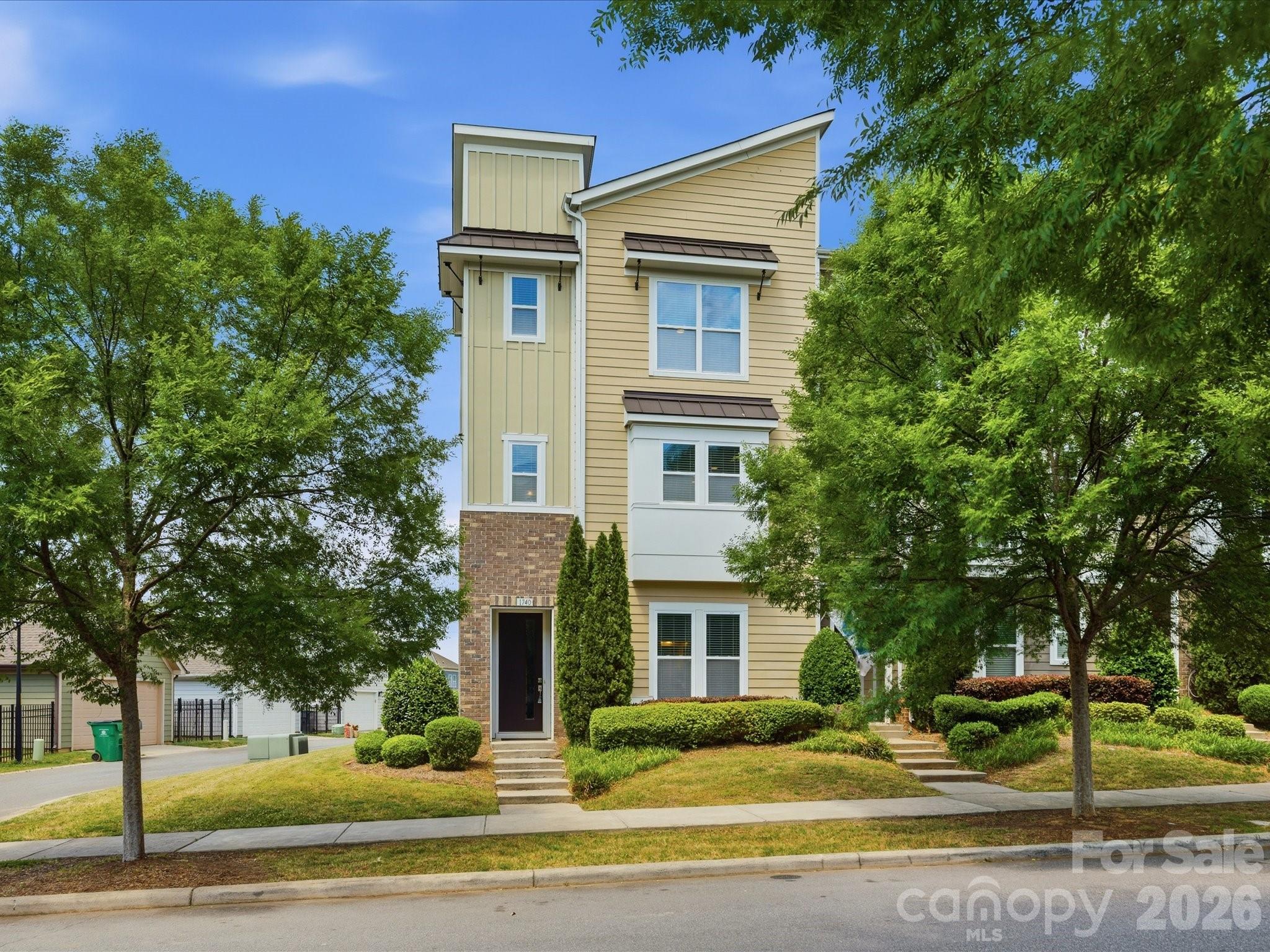Welcome to this stunning end-unit townhome offering 3 bedrooms, 3.5 baths, and a 2-car garage in an unbeatable prime location! This rare end-unit opportunity delivers an open-concept floor plan flooded with natural light, soaring 9-foot ceilings, and gorgeous luxury vinyl plank (LVP) flooring throughout. The modern chef's kitchen is the heart of the home, featuring crisp white cabinetry, matching white appliances, granite countertops, a full walk-in pantry, and ample prep space—ideal for everyday living and effortless entertaining. A convenient half bath sits just off the kitchen on the main living level, perfect for guests. A versatile 1st floor guest bedroom with a designer en-suite bath, stone countertops, and stunning herringbone tiled shower offers the perfect setup for multigenerational living, a private home office, or visiting guests. On the 3rd floor, the spacious primary suite is a true retreat with an oversized walk-in closet and luxurious owner's bath featuring quartz countertops, while the additional bedroom boasts its own full en-suite bath with stone counters and beautiful tile shower—a rare layout where every bedroom enjoys private bath access. With abundant natural light, modern finishes, and a thoughtful floor plan that lives larger than the square footage suggests, this move-in ready end-unit townhome combines style, function, and location into one exceptional package!