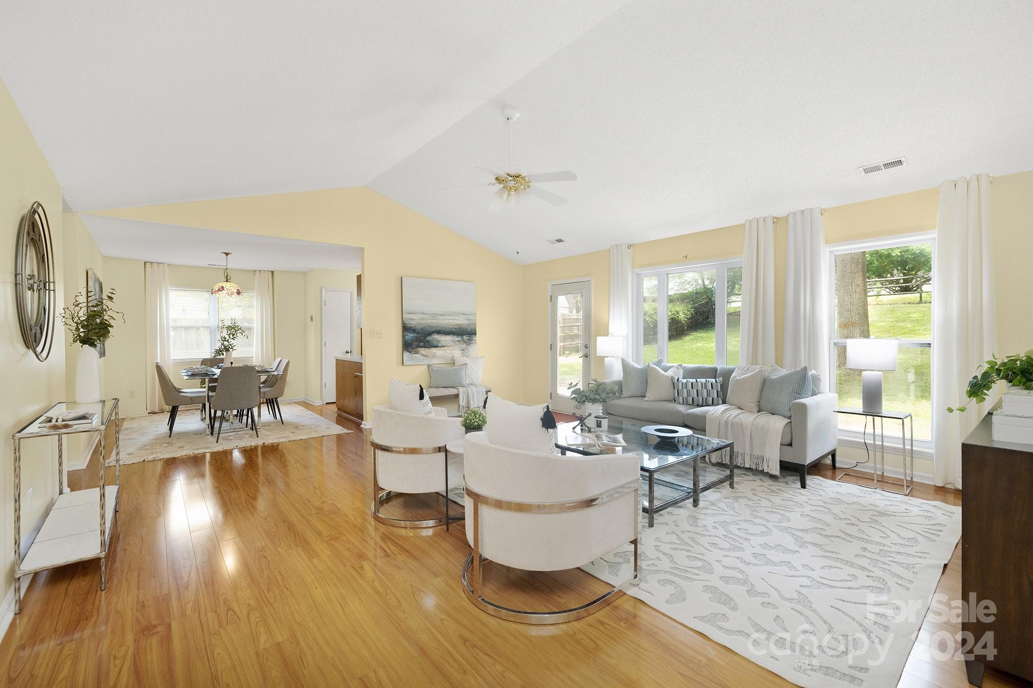 You will feel right at home in this bright, open floorplan!  The spacious family room looks out on the large fenced yard with mature trees and a huge patio for relaxing with family and friends.  Large primary bedroom features vaulted ceilings, two closets and room for a king sized bed.  The kitchen is small but mighty, with more cabinets and counter space than you are used to seeing.  It even includes a pantry!  This home has a two car garage, a rare find at this price point.  Exterior was recently painted and new carpet has been installed. Windows have been replaced in the dining room, kitchen, and family room. It's ready for you to put your personal touches on this sweet home and make it your own!  Refrigerator, washer, and dryer to remain.
