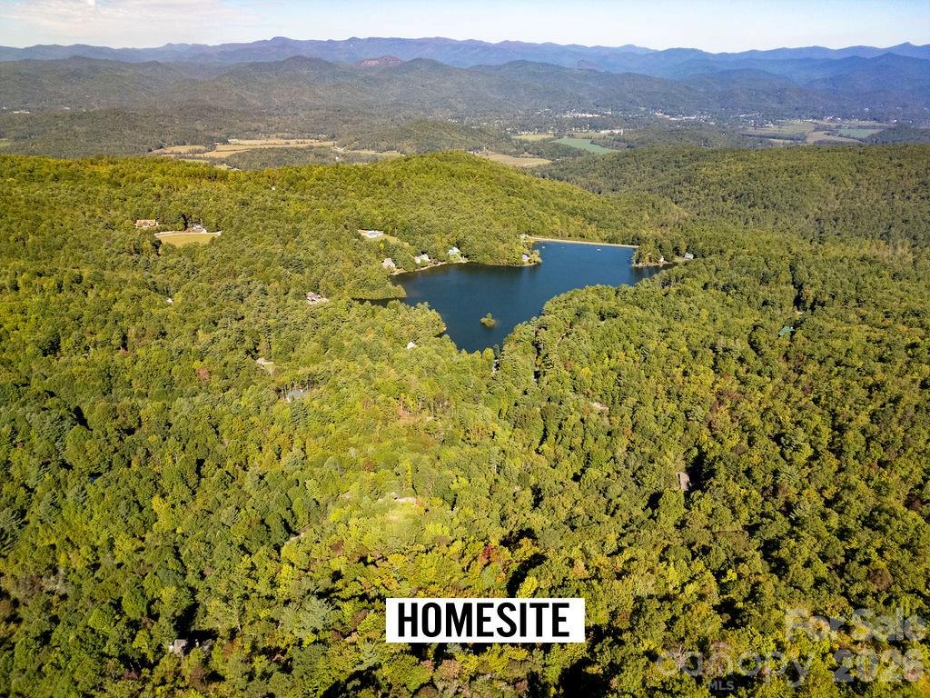 Rare and remarkable opportunity in the highly sought-after Eagle Lake community—this property was originally a 6.98± acre tract and has now been divided into two separate parcels (approximately 3.09 acres and 3.799 acres), each with its own parcel number. The parcels may be offered individually or together as one exceptional estate opportunity.

Due to the terrain and in order to optimize septic placement, the current property lines may be reconfigured. Any revisions will be completed and approved by the ARC, a licensed surveyor, and recorded with the county. Final acreage and boundary lines are subject to change until officially recorded, offering flexibility to maximize building sites and drain field locations.

Each parcel offers outstanding potential—create a private mountain retreat or develop two distinguished homesites, both with sweeping long-range mountain and lake views and serene surroundings.

Eagle Lake is renowned for its tranquil atmosphere, scenic beauty, and private 32-acre lake, ideal for kayaking, fishing, or simply enjoying the peaceful mountain setting. Located just minutes from downtown Brevard, you’ll experience the charm of this vibrant mountain town along with convenient access to Pisgah National Forest, DuPont State Forest, and the Blue Ridge Parkway—offering world-class hiking, biking, waterfalls, and outdoor adventure. Ideally situated near both Hendersonville and Asheville, this is a premier Western North Carolina destination to enjoy all four seasons.