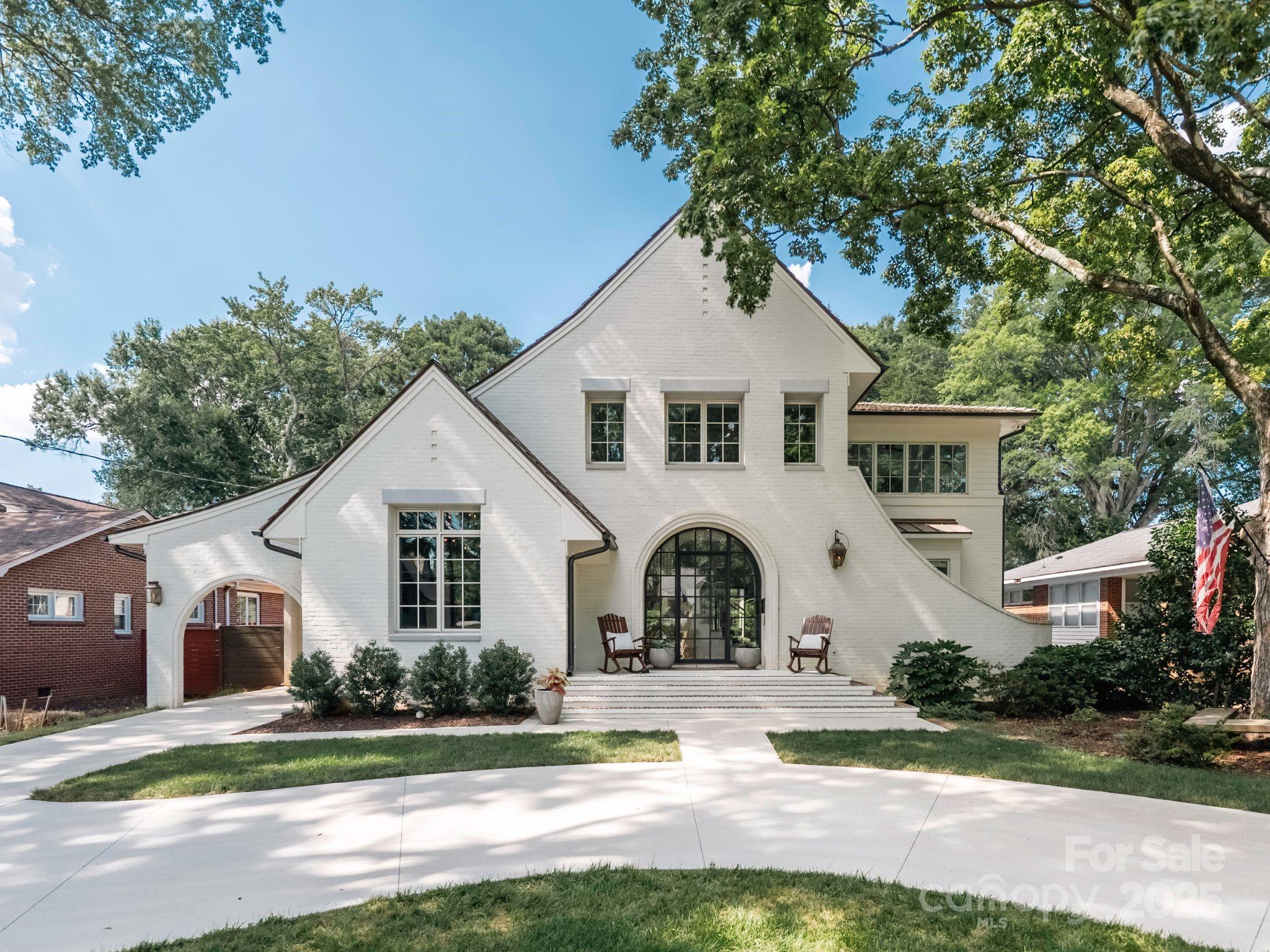Welcome to this thoughtfully designed new-build home completed in 2021, built for a lifestyle of elegance and entertainment. Its open floor plan, filled with natural light, showcases light oak hardwood floors, a grand stone gas fireplace, and Sonos surround sound across the living, kitchen, family room, primary suite, office, and porch. The chef’s kitchen features a professional range with plaster hood, paneled Bosch appliances, a wine fridge, and a custom island with under-storage, perfect for gatherings. The primary suite, with dual walk-in closets, and a spa-like bath with dual vanities and designer lighting, offers a serene retreat. A guest suite above the garage and a bonus room add versatility. Outside, a cedar shake roof, turfed low-maintenance yard, pool with copper water features, and a covered porch with fireplace enhance outdoor living. Walkable to Park Road Shopping Center, this 5-bed, 5.2-bath home blends timeless sophistication with urban convenience.