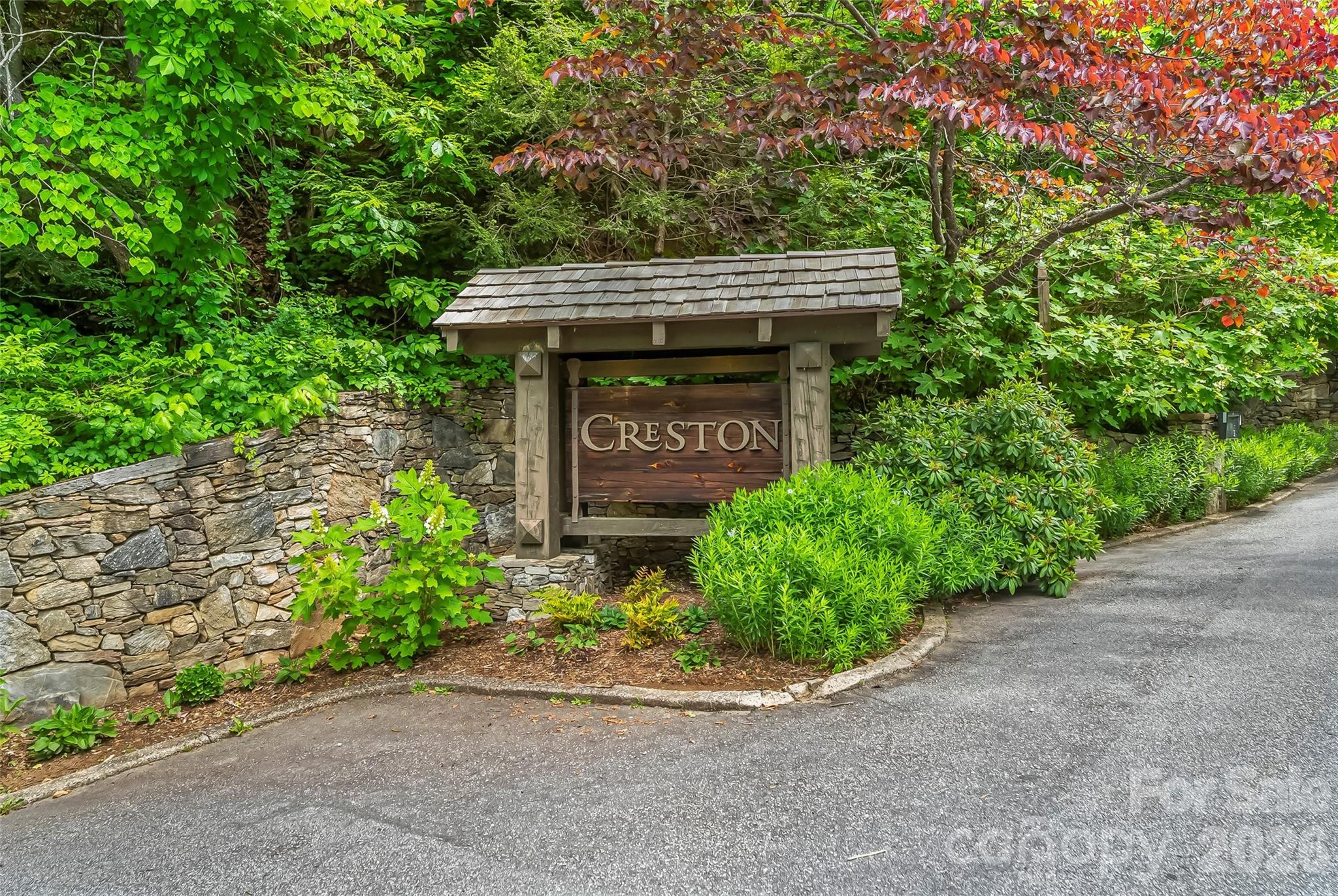 Escape to the prestigious, gated Creston community to find this exceptional 1.05 acre homesite. Nestled at the end of a private cul-de-sac and bordered by protected conservation land, this property offers the perfect canvas for a mountain dream home, weekend retreat, or premium investment build. A well is already installed on the property and it has previously perc tested for septic, offering a strong head start for the next owner's future plans. Imagine your home in the mountains framed by potential long-range views of the neighboring conservation acreage. Enjoy the peaceful atmosphere of this natural, yet refined community featuring miles of trails, waterfalls and filled with high-end homes, quality cabins and charming cottages. Approximately 25 minutes to downtown Black Mountain and under 45 minutes to Asheville.