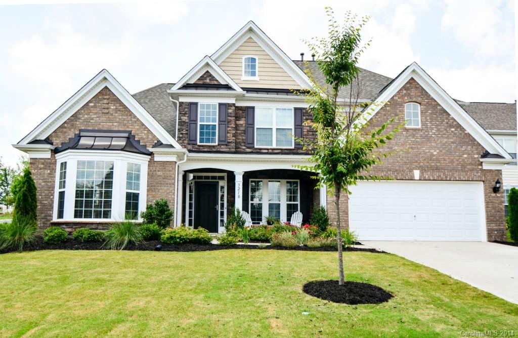 Beautifully landscaped corner lot with fenced yard and extended patio for entertaining! Across the street from the neighborhood amenities! This home has all of the upgrades: Dark hardwood floors throughout main, master on main, gorgeous kitchen cabinets with custom backsplash, granite countertops, two story great room, iron spindles on stairway, closet organizing systems, large bonus room with extra attic storage space. This home has it ALL!