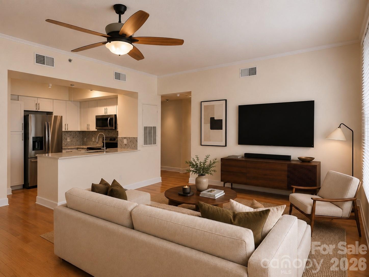 Perfectly positioned in the heart of Dilworth, this beautifully updated one-bedroom condo delivers low-maintenance living with a lifestyle centered around convenience and connectivity. Nestled between Latta Park and Freedom Park, you'll enjoy easy access to some of Charlotte's best shopping, dining, green spaces, and everyday conveniences. Located on the fourth floor overlooking the community courtyard, this spacious unit offers nearly 950 square feet of living space. The generous floor plan is highlighted by an oversized living room and separate dining/study area, offering flexibility for its desired use. Large windows and a sliding glass door fill the condo with natural light and hardwood floors extend throughout the main living areas and bedroom. The kitchen showcases beautiful cabinetry with quartz countertops and a stylish backsplash, along with stainless steel appliances. The updated bathroom includes a tiled shower with tub, modern vanity, and a laundry closet with side-by-side washer and dryer, both of which convey. Storage unit on the same floor is also included. Residents enjoy a secure-entry building with gated resident parking, as well as access to amenities including elevators, a fitness center, and rooftop terrace. Combining an exceptional Dilworth location, a spacious floor plan, and tasteful updates throughout, this charming condo is ready for its next owner to enjoy!