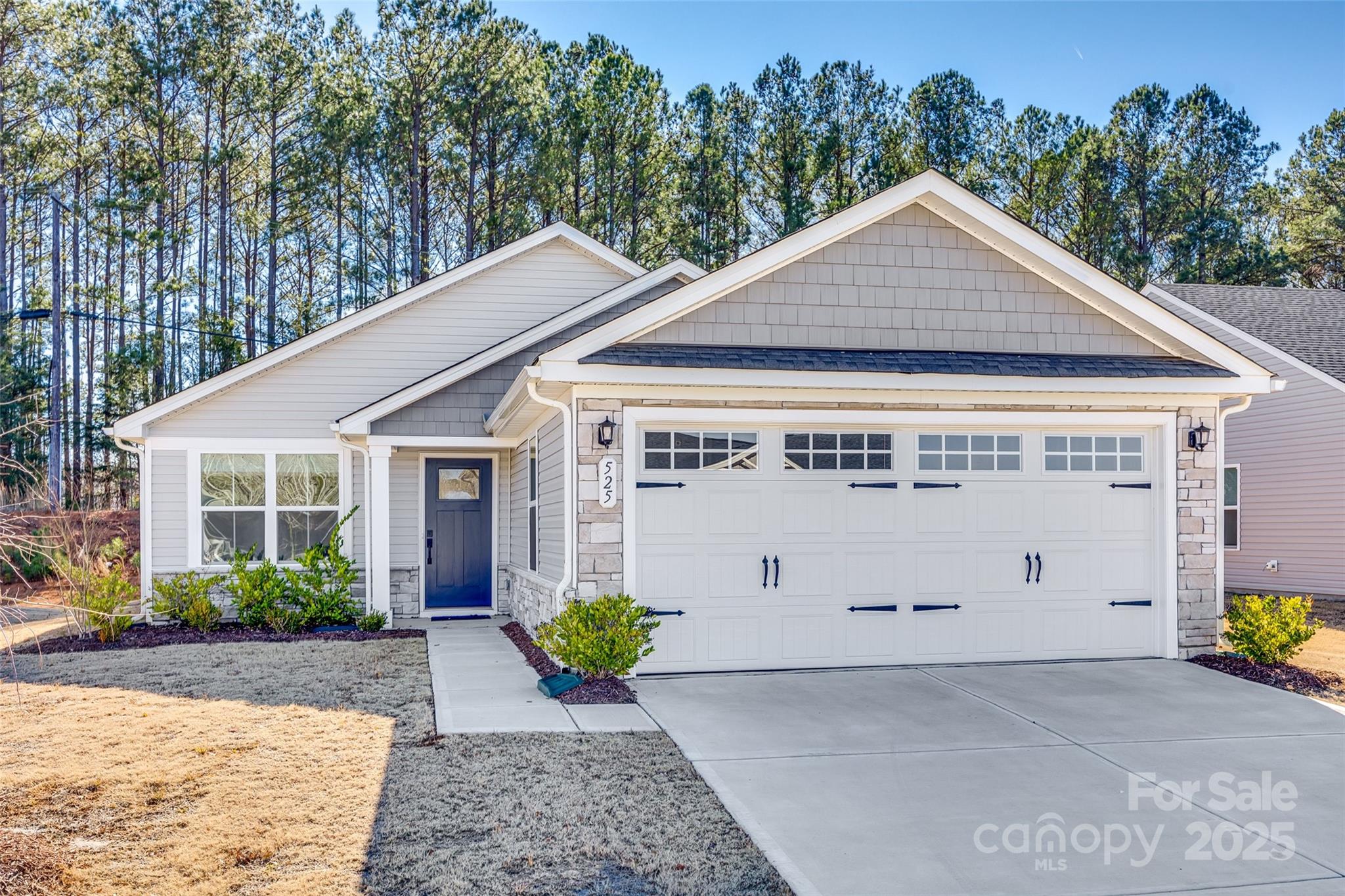 Craftsman style, one level ranch that is less than a year old! This plan offers 2 bedrooms, 2 baths featuring LVP flooring, ceramic tile in baths, quartz countertops in kitchen, electric smooth top range, dishwasher, and microwave.  Enjoy the backyard while sitting on the covered patio.  Check out this home today.