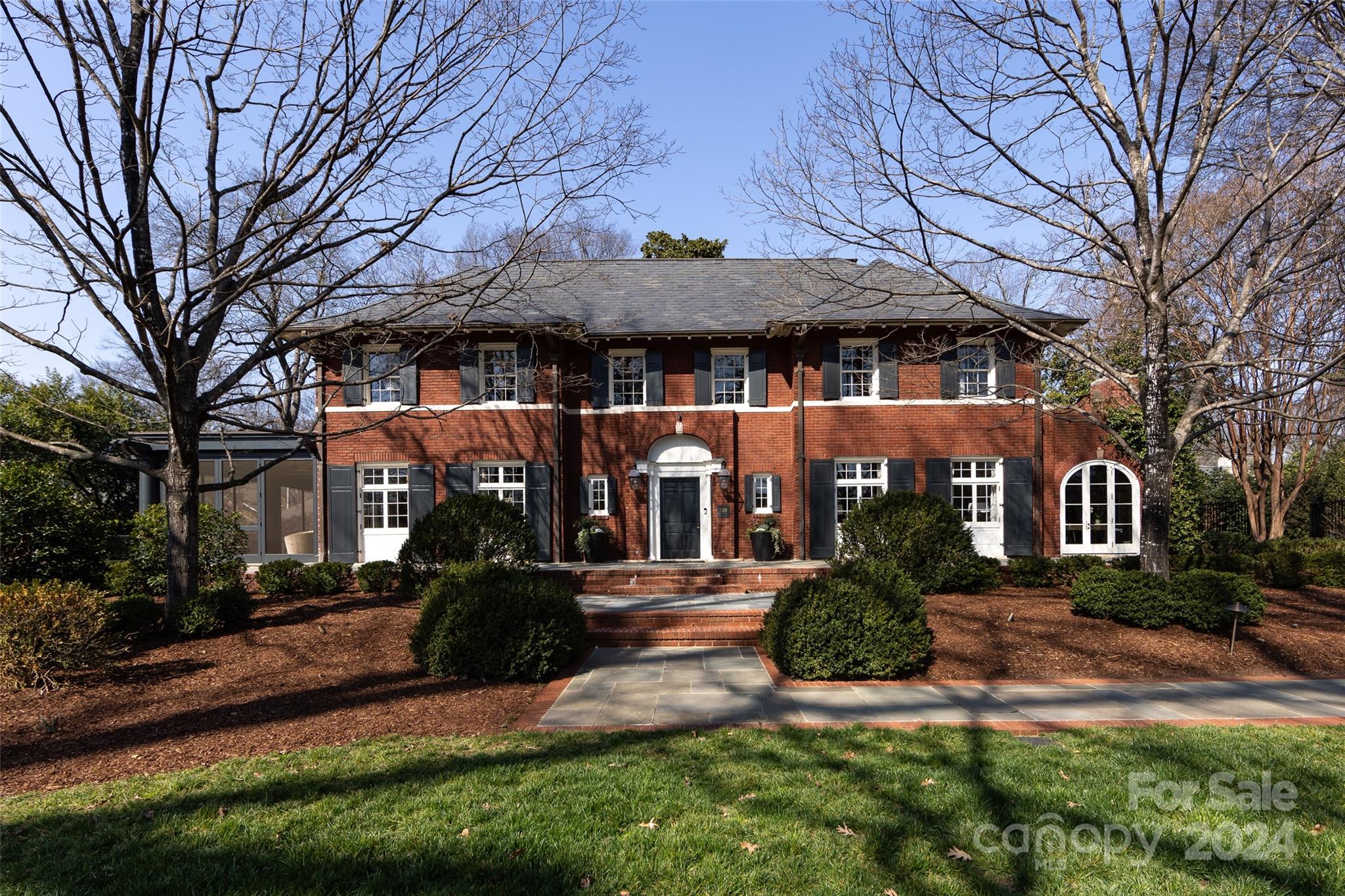 This private, one of a kind architectural wonder is prominently situated on Charlotte’s most coveted tree-lined street within walking distance to the burgeoning global dining scene. An unprecedented renovation maintains the original charm while updating the floor plan for a relaxed modern lifestyle.Nationally recognized architect Ruard Veltman, Whitlock Builders & interior designers Cindy & Heather Smith collaborated to ensure the seamless integrity of the exterior &interior.6 beautifully appointed fireplaces each have a custom design.Living Rm features a hand-plastered fireplace. Kit. is worthy of a master chef but designed w/a family in mind.Master closet rivals your favorite luxury boutique w/clothing rods w/LED lighting to easily find what you are looking for.Large pool, spa are seamlessly integrated into backyard, visible from gracious screened porch.Almost an acre, these captivating grounds are perfect for entertaining while bringing the utmost in privacy+peace.