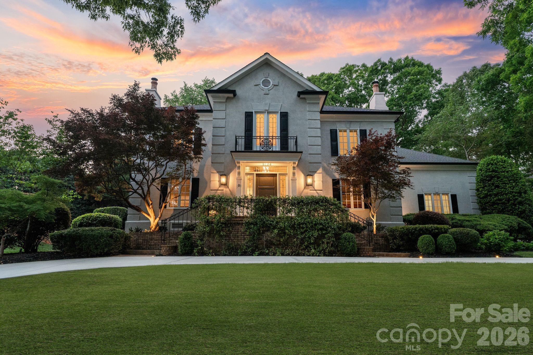 Located in the prestigious Quail Hollow neighborhood, this exceptional residence is a rare opportunity to own in one of Charlotte's most desirable areas. Just minutes from SouthPark and top private and public schools, this stately home offers the perfect balance of peaceful neighborhood living and everyday convenience. 

From the moment you arrive, the gracious curved driveway and freshly repainted exterior make a lasting first impression. Inside, a grand two-story foyer with a sweeping curved staircase, arched doorways, chandelier, and refined molding details throughout set an elegant tone, speaking to the level of craftsmanship found at every turn. A striking fireplace anchors the refined family room, which opens seamlessly into the formal dining room beneath a statement chandelier. 

The chef's kitchen shines with professional-grade Sub-Zero refrigeration, Bosch double ovens and gas cooktop, custom floor-to-ceiling cabinetry, and a generous island, all complemented by a sunny breakfast area with access to the outdoor patio dining area. A generous walk-in pantry provides abundant storage, and a well-appointed laundry room with ample cabinetry and folding space adds everyday practicality. The inviting sitting room features a stone fireplace, custom built-ins, and an elegant hidden wet bar, offering wonderful flexibility to the main level, whether utilized as a home office or a secondary lounge.

The primary suite serves as a true sanctuary, complete with a spa-inspired bath featuring a soaking tub, an oversized walk-in shower, a skylight, three vanity areas, and dual custom walk-in closets. 

Upstairs, four generously sized guest bedrooms offer comfort, privacy, and versatility, accommodated by two private ensuite bathrooms and a Jack-and-Jill bath. An expansive attic with custom built-in storage closets provides bonus space. 

Outdoors, the fully fenced lot of just over one acre is an entertainer's dream. A generously sized swimming pool anchors the backyard, accompanied by an expansive lounge area and an outdoor dining patio featuring a wood-burning fireplace and a built-in grill station. Mature trees and lush, professionally landscaped grounds frame the property beautifully, creating a true sense of privacy and seclusion. A two-car garage and a separate one-car garage provide ample storage and parking. 

With nearly 5,000 square feet of living space, thoughtful updates throughout, and resort-style outdoor living, everything about this home has been designed to impress and built to last.
