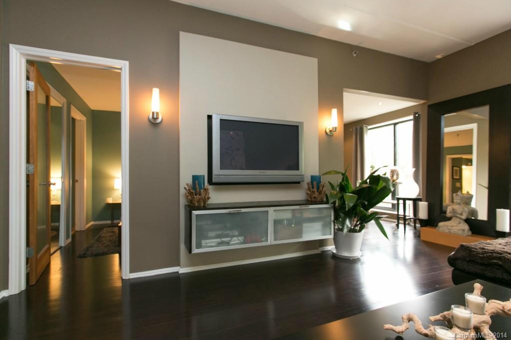 Contemporary top to bottom fully remodeled 926 sq ft unit. Engineered hardwood floors, pin spot recessed lights, tile floors (one bathroom floor heated & heated towel rack too), modern style kitchen cabinets & hardware, granite tops, glass tile splash, stainless appliance pkg incl. refrigerator, contemporary lights/dimmer switches thru out! Glass block accents, slider access to private balcony. This GORGEOUS 5th floor unit also includes 1 covered parking space & private storage area! SEE TOUR!