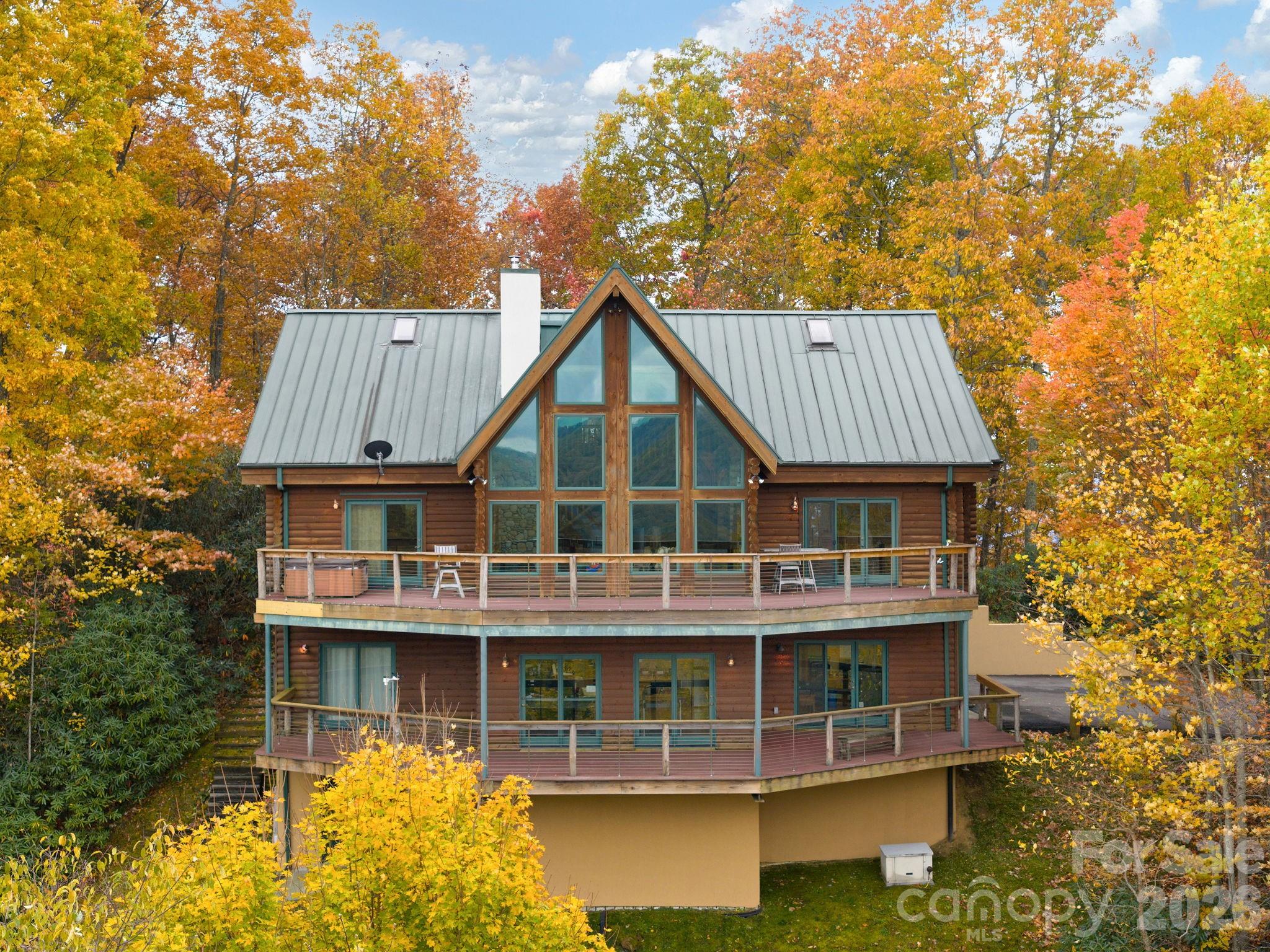 Perched at the top of the world, this extraordinary estate offers more than a home—it delivers a lifestyle defined by awe-inspiring beauty, serenity, and elevation in every sense. From the moment you arrive, you’re greeted by truly unmatched, long-range, year-round mountain views that stretch endlessly across the horizon, creating a daily backdrop that feels nothing short of cinematic.

This immaculate custom-built residence was thoughtfully designed to capture and celebrate those views from nearly every angle. The living room becomes your personal front-row seat to nature’s masterpiece, where expansive windows frame the mountains like living art—sunrises, sunsets, and rolling clouds included.
At the heart of the home, a spacious, well-appointed kitchen offers both functionality and elegance, featuring abundant cabinetry, generous storage, and ample room to gather, entertain, and create. Whether hosting guests or enjoying a quiet evening, the flow of this home is both inviting and impressive.

The owner’s suite is a private retreat unto itself—generously sized and positioned to take full advantage of the breathtaking scenery. Imagine waking each morning to sweeping mountain vistas, stepping directly onto your private front deck, and starting your day above it all. The deck, complete with a large hot tub, invites you to unwind while soaking in some of the most captivating views imaginable.

Downstairs, the finished basement expands your living possibilities with a flexible layout that includes office space, a potential second living area, and even more room to tailor to your lifestyle. A private sauna and tanning bed elevate the experience, creating a spa-like environment within your own home, while additional storage ensures everything has its place. A two-car garage adds convenience, while every detail throughout the home reflects quality craftsmanship and intentional design.

This is more than a property—it’s a rare opportunity to live immersed in the beauty of the mountains, where every day feels like a getaway and every moment is elevated.

No drive by's, gated property.