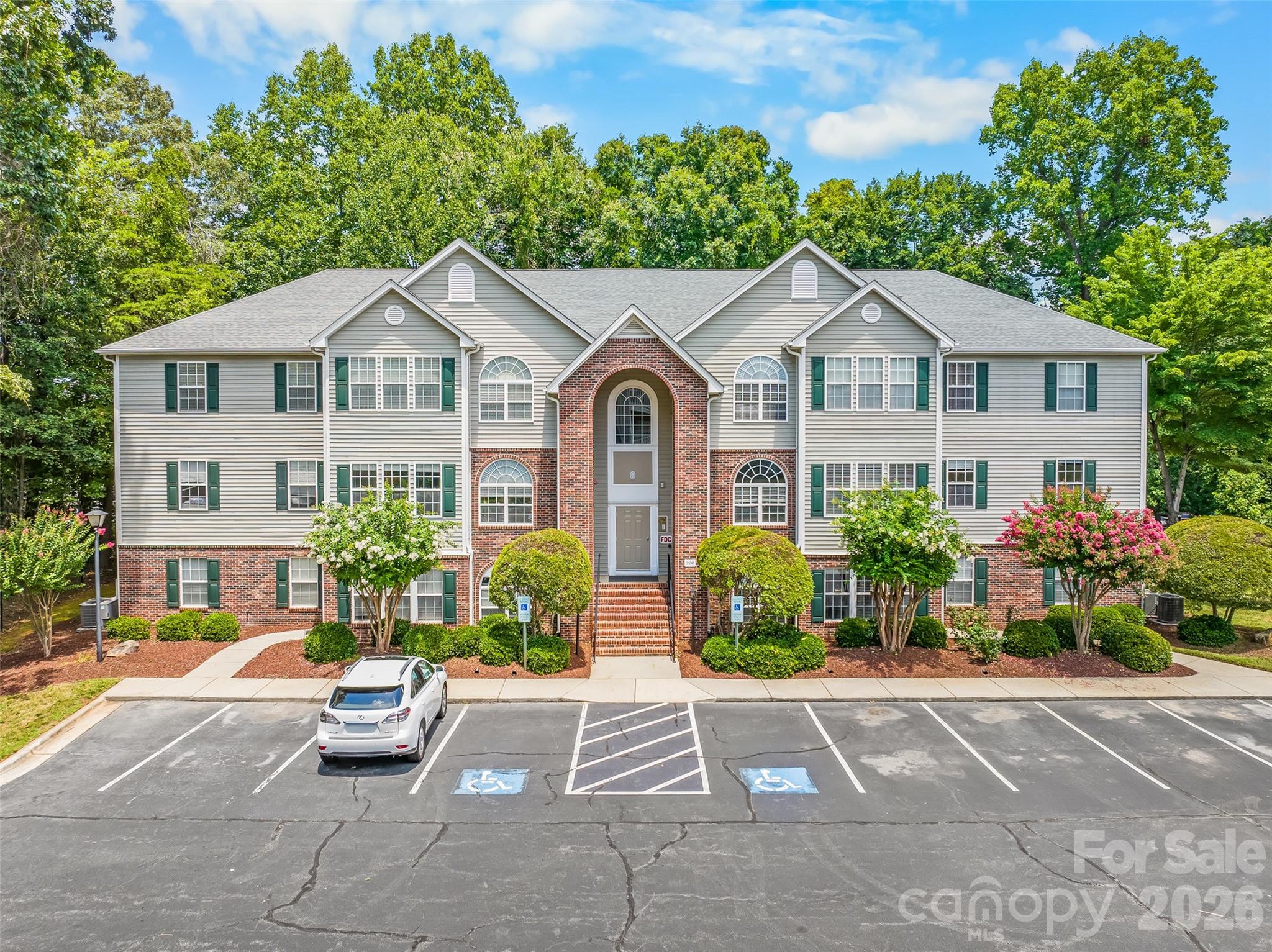 GO DEACS! This well-maintained 2BR/2BA condo in gated Deacon Ridge offers comfort, convenience & security. Enjoy a secure main entry w/ upgraded intercom system, cameral monitoring plus a 2nd-floor location for added privacy & energy efficiency. Inside you'll find updated LVP flooring in the main living areas, a recently replaced HVAC, abundant natural light from oversized windows & a cozy fireplace for chilly evenings. All appliances remain, making your move even easier. Just minutes from Wake Forest University, shopping, dining & downtown Winston-Salem. Whether you're looking for a primary residence, game-day retreat or investment opportunity, this move-in-ready condo checks all the boxes!
