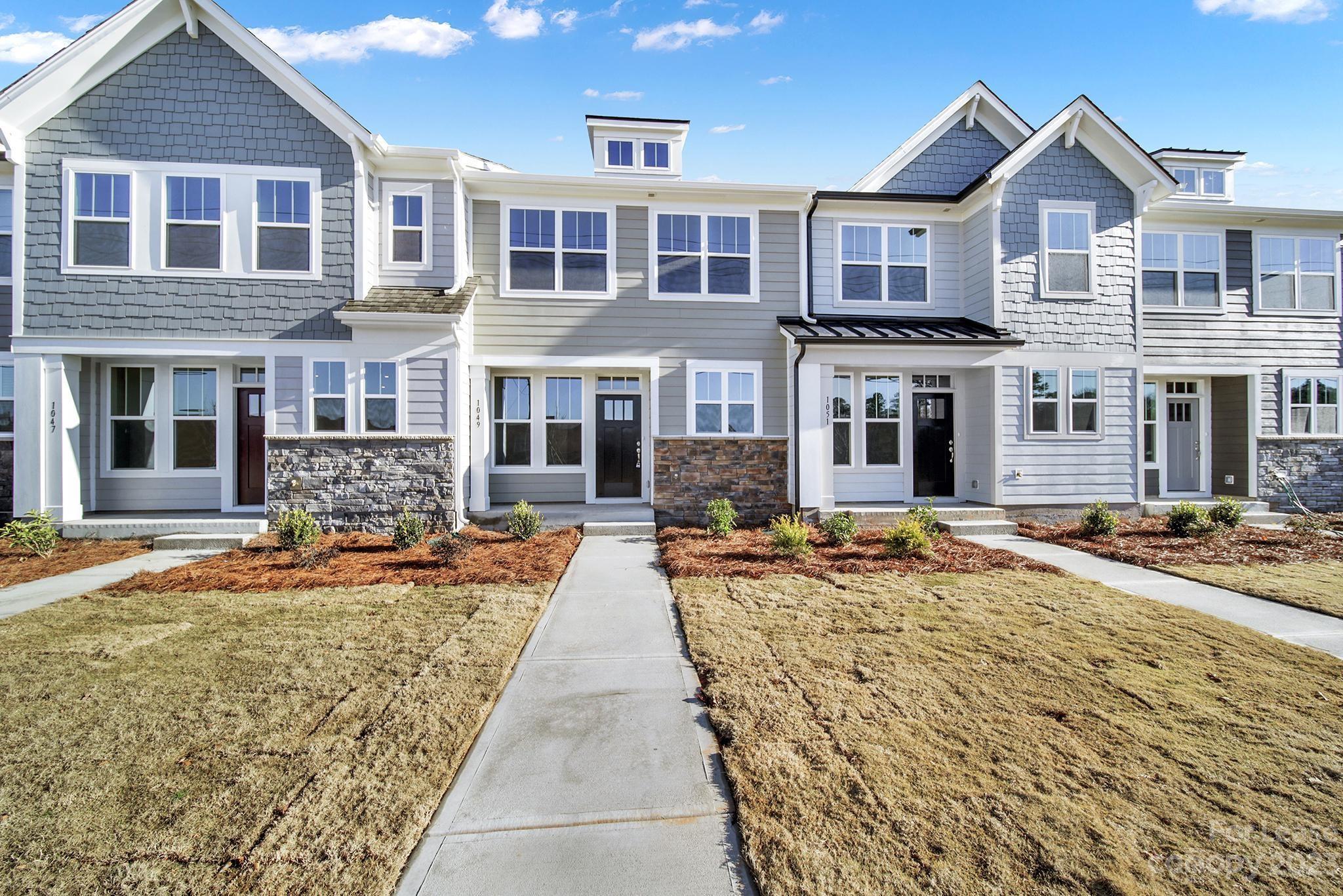 Welcome to this Lovely Brand New Townhome in Belmont! This stunning home offers a modern and stylish living experience in a prime location. With 3 bedrooms and 2.5 bathrooms, this townhome provides ample space for comfortable living. The gorgeous kitchen is a chef's dream, featuring a center island that is perfect for meal preparation and entertaining guests. The open concept and spacious design create a welcoming atmosphere, allowing for seamless flow between the kitchen, dining area, and living room. Convenience is key with a 1 car rear entry garage. With an upstairs laundry room, there's no need to haul laundry up and down the stairs. Located in Belmont, NC, this home is surrounded by a vibrant community with access to a variety of amenities and attractions. Whether you're looking to explore the local shops and restaurants or enjoy the nearby parks and recreational areas, there is something for everyone to enjoy.