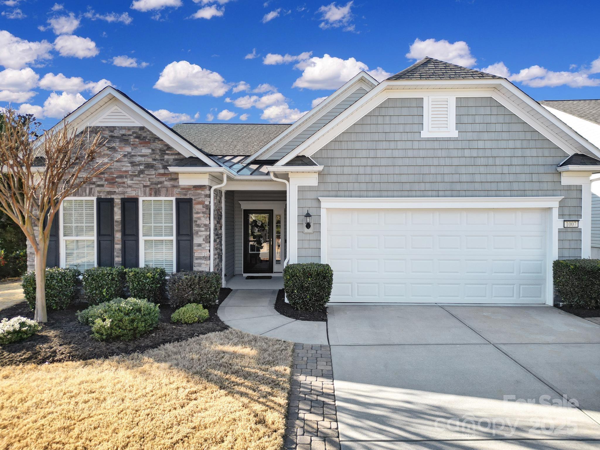 BEAUTIFUL Tifton Walk home in Sun City Carolina Lakes! Gleaming wood flooring flows throughout the home. French doors open to a personal tavern, ideal for entertaining or home office. Open living area features gas log FP. Newly UPDATED kitchen boasts white cabinets, Quartz countertops, marble backsplash, under cabinet lighting, new SS appliances, gas range, island w/breakfast bar & dining area. Step into the light-filled sunroom overlooking a custom covered patio w/ceiling fan, by David Dunn. Outdoor living at its finest! Primary suite sits at the back of the home w/tray ceiling, ensuite bath w/soaking tub, glass enclosed shower, dual sink vanity & custom walk-in closet. 2 guest bedrooms in front of the home w/access to a full hall bath. Dream laundry room + epoxy floor in garage w/storage. HVAC 2023, Water Heater 2022. Add'l Features Sheet in attachments. Enjoy resort-style amenities, social clubs & golf course. Conveniently located to shopping, grocery, restaurants & medical.