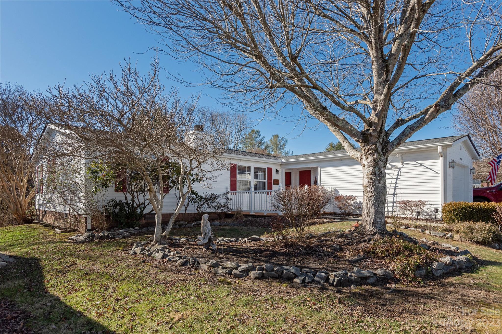 Welcome to Riverwind! A fantastic 55+ community in the wonderful Etowah community. This home offers a desirable split bedroom floorpan, a heated sunroom (not counted in overall HLA), and a garage. Home was purchased by this seller in 2023 and is being sold due to health reasons. During ownership the seller has replaced the roof, converted the range to natural gas and replaced with a new stainless steel gas range with a built in convection oven and air fryer, replaced the refrigerator (new and old refrigerator, now in utility room, convey), new gas logs with remote and had a utility sink put in utility room. The sun room and deck offer great outdoor living options and room to breathe! This is a great home in a great community! Schedule your showing today!