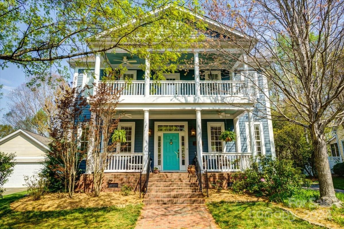 Charming Charleston-style home in Baxter with double front porches and mature landscaping. Recently painted exterior adds to curb appeal. Inside, find 10' ceilings and hardwood floors. Kitchen boasts 42" cabinets, large island, double wall ovens, and gas range. Great room features elegant shiplap accents around gas log fireplace. Upstairs, enjoy 9' ceilings and access to second-level porch. Master bath remodeled with tile surround garden tub, glass shower, and dual vanities. Peaceful location backing onto Baxter trails. Baxter Village amenities include pool, playground, clubhouse, tennis courts, and walking trails. Close to shops, restaurants, and easy highway access.