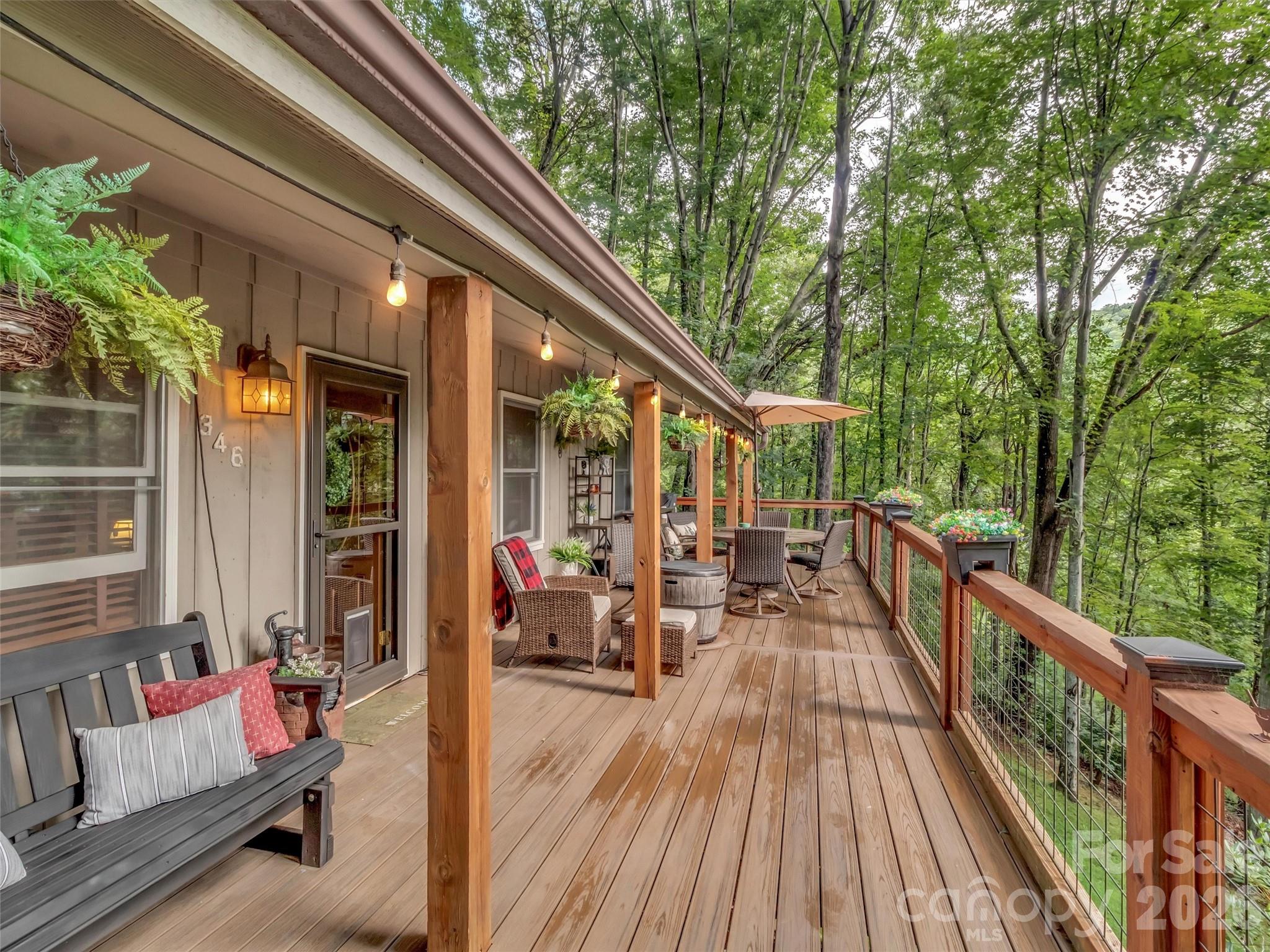 ****Price Reduction****Welcome to your cool mountain retreat! This well-maintained and updated home is at a 3000' elevation and features a semi-covered upper deck that faces east to enjoy the sunrise or beat the evening heat. Also, you have a lower porch for more outside living space. Inside on the main level, you have 3 bedrooms and 2 full baths, along with a great room combination of living, dining, and kitchen space. Downstairs, you have a large recreation room with a half bath and a large storage space. This could be what you are looking for in a permanent or a second home in the mountains of Western North Carolina!!