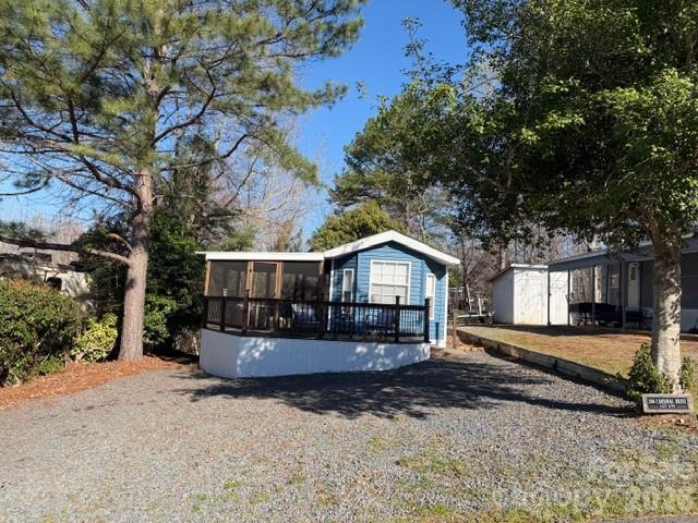 Looking for your dream home at Badin Lake we have a cozy newly remodeled park model with updated appliances, washer & dryer combo, newer rook, screen porch and open back deck nice shady yard with fire pit sitting area, some lake view. This place needs nothing it is so cute and ready to go.  Ship-lap walls with beautiful wooden beam makes you feel like you are in a resort, modern lights thru out very nicely decorated and interior designs were done on this one.  Roof was updated 2023, along with windows, stainless steel appliances and combo washer & dryer included.