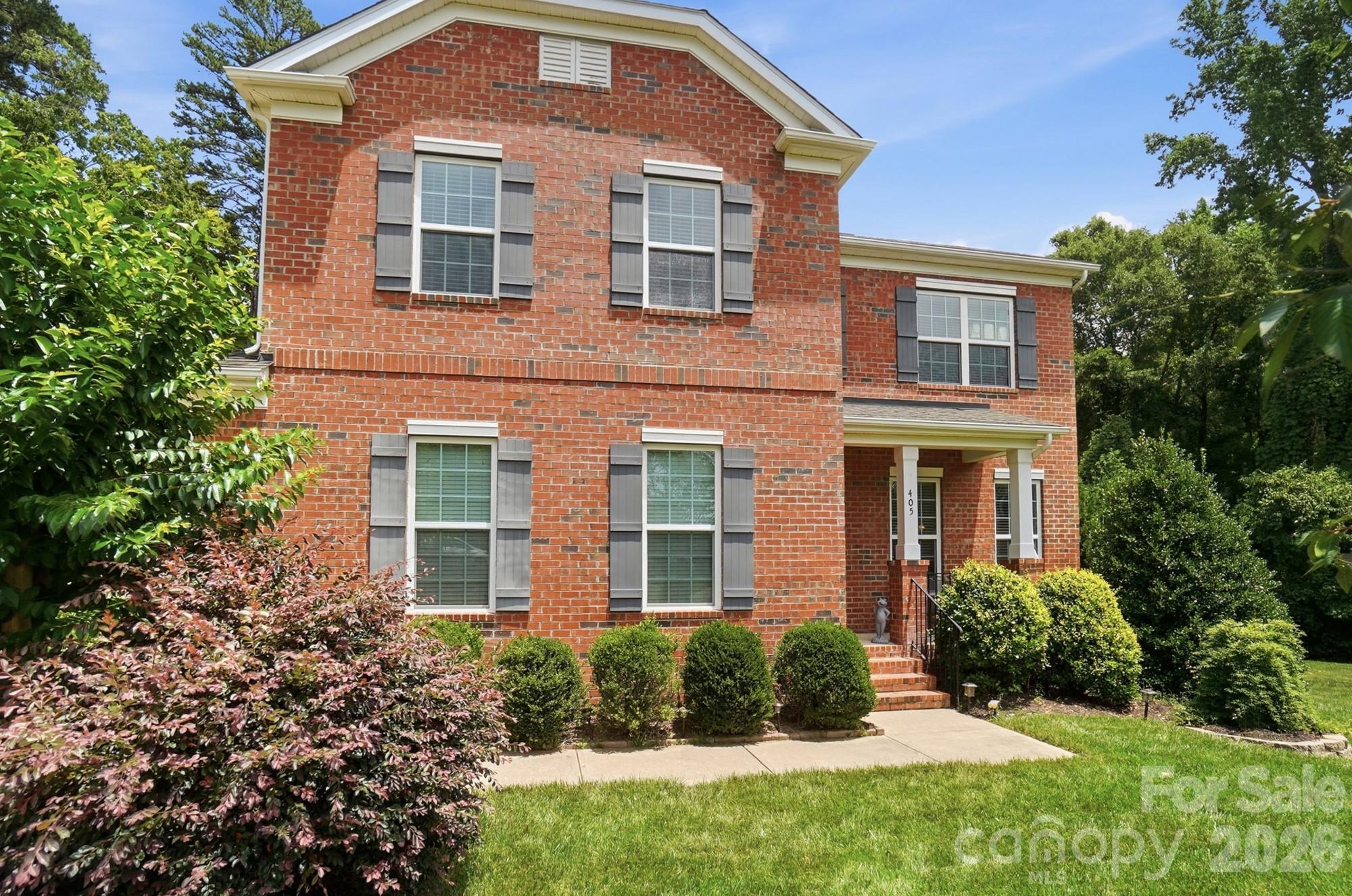 Tucked away on a quiet cul-de-sac and backing to a natural wooded backdrop, this exceptional 4-bedroom home offers a rare blend of elegance, privacy, and tranquility. Thoughtfully designed with timeless finishes, rich hardwood floors, detailed wainscoting, and a charming tucked-away staircase, the home exudes warmth and character at every turn. Sunlight fills the inviting living spaces, while the covered back deck and breathtaking gardens create a peaceful retreat that feels worlds away from the everyday. With no future development behind the property, a sprawling 0.75-acre lot, and beautifully curated outdoor living spaces, this is more than a home—it's a sanctuary. Garden enthusiasts and nature lovers alike will appreciate the thoughtfully designed landscape, which includes a rose garden, butterfly garden, hosta garden, perennial garden, and a Certified Wildlife Habitat® that attracts birds and pollinators throughout the seasons. A unique dry creek feature winds through the  property and has been beautifully incorporated into the landscape design, enhancing the natural character of the setting. This seasonal creek feature typically carries water only during and shortly after rainfall, while contributing to the property's picturesque and park-like atmosphere year-round.The fully fenced backyard also  Includes an interior fence, creating distinct spaces for gardening, recreation, pets, or play. With abundant outdoor space, mature landscaping, exceptional privacy, and meticulous care throughout, this property offers a lifestyle that is increasingly difficult to find. -- A truly special home where comfort, nature, and convenience come together.