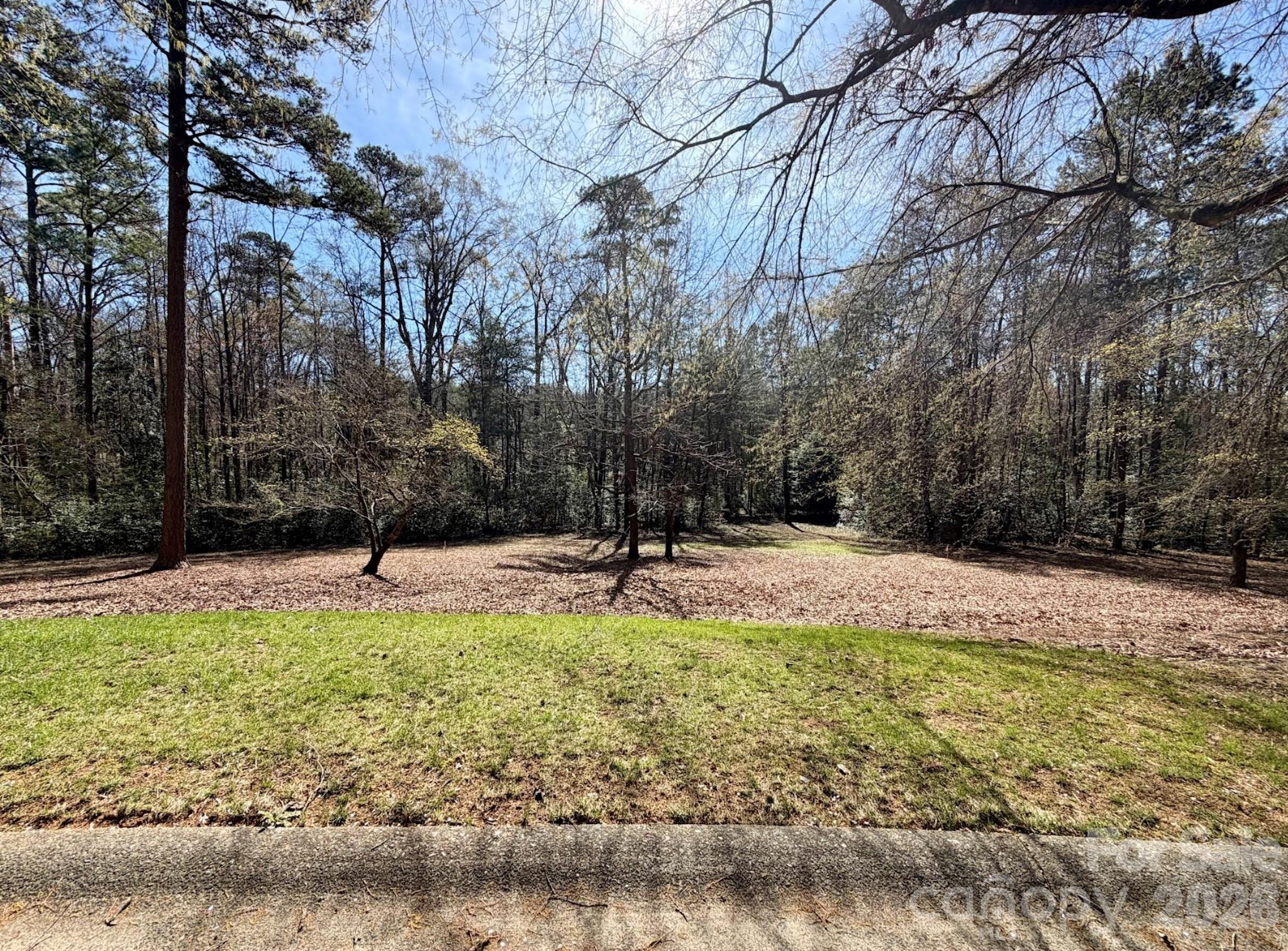 Beautiful homesite in the Millingport neighborhood of Old North State Club's gated community! Build your dream home and enjoy exceptional views and the convenience of the neighborhood putting green across the street. The lot is an easy walk to Old North State Club amenities. Become a member of the Club for access to its championship golf course, dining, pools, tennis/pickleball courts & more.