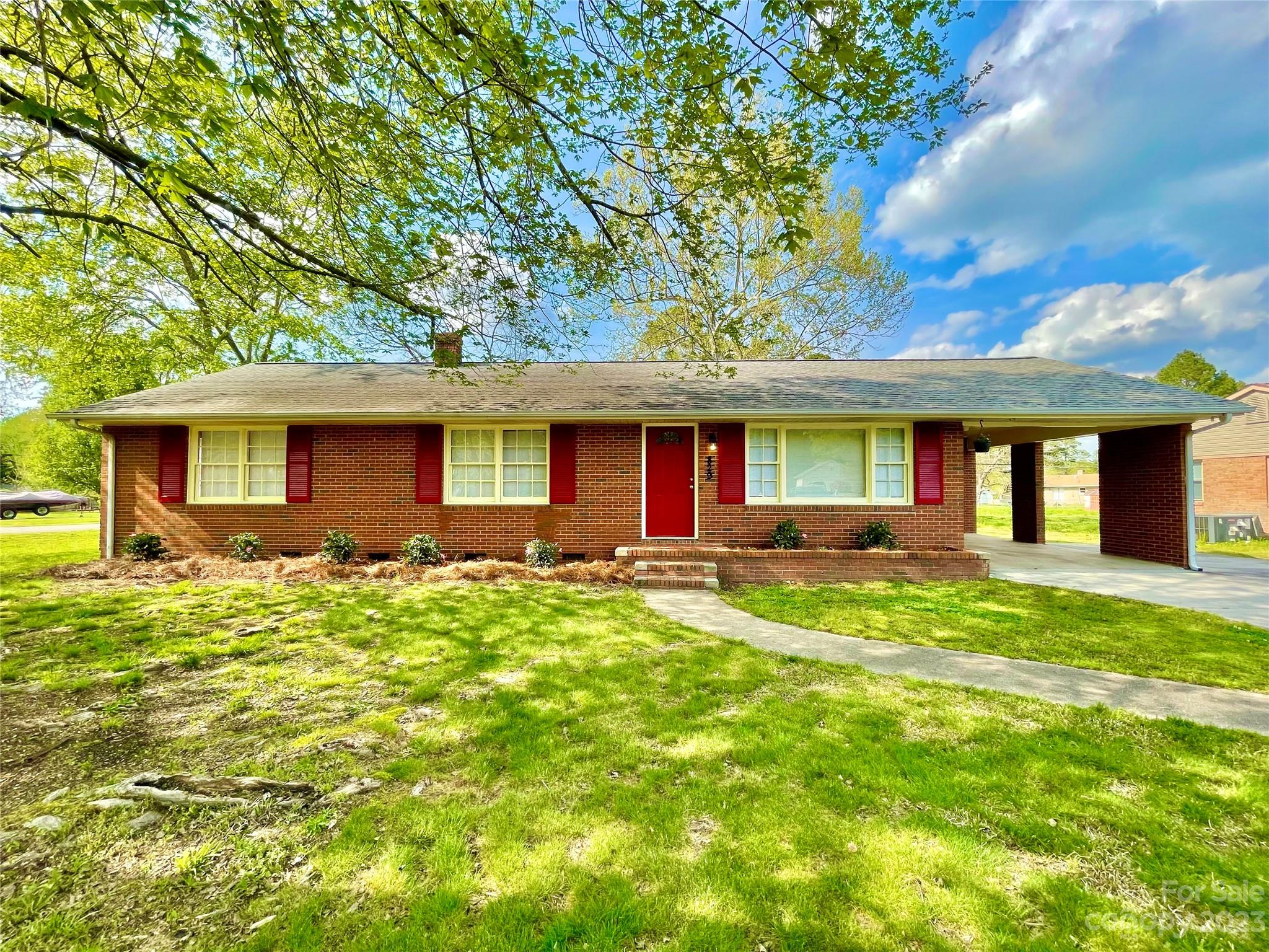 This adorable brick ranch has been been remodeled and is move-in ready! With 3 bedrooms, 1 full and 1 half bathrooms, large tree-lined corner lot, carport with utility room, new paint throughout, new LVP flooring in kitchen, dining, and living rooms, new kitchen sink and faucet, original hardwoods in bedrooms, all-new full bath, new HVAC in 2017, new landscaping in flower beds, and tons of kitchen cabinet storage this home is perfect for first-time home buyers, investors, or any homebuyers looking for a great home in a quiet, established neighborhood. Just minutes from I-77/downtown Rock Hill and NO HOA! Washer, dryer, and refrigerator will stay in home.