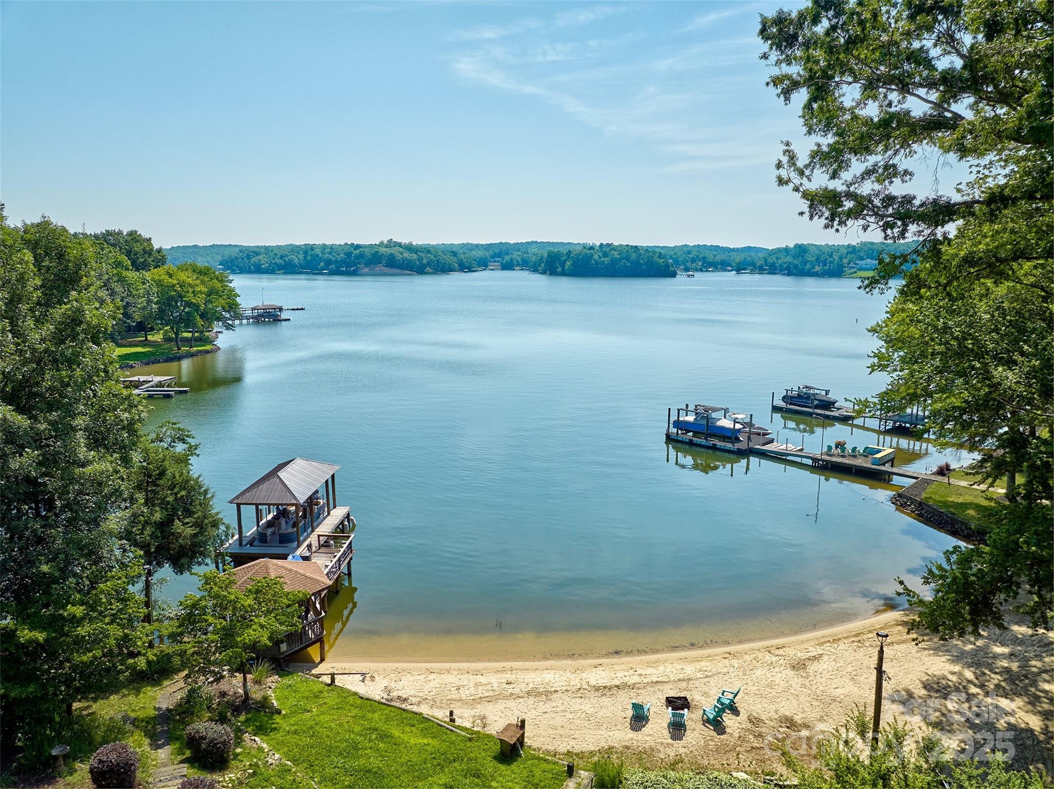 AMAZING & UNIQUE WATERFRONT HOME ON A QUIET COVE W EXPANSIVE MAIN CHANNEL VIEWS OF LAKE WYLIE!HOME HAS 2 DOCKS & 2 SANDY BEACHES.HOME OFFERS MULTIGENERATIONAL LIVING OR INCOME PRODUCING WHILE YOU LIVE THERE/HOWEVER YOUR FAMILY WANTS TO USE IT. HOME HAS 2 KITCHENS AND CAN BE BLOCKED OFF FOR SEPARATE LIVING AREAS.ENTIRE LIVING SPACE OFFERS 5 BEDRMS, 3 FULL BATHS,GREAT ROOM W/CATHEDRAL CEILINGS, COZY DEN W/ GAS FIREPLACE,2 LAUNDRY AREAS(UPSTAIRS& DOWNSTAIRS) ,ALL NEW WINDOWS ,NEW COVERED DOCK W LIFT,NEW TANKLESS WATER HEATER,NEW WHOLE HOUSE FILTRATION SYSTEM &MUCH MORE.THE LOT IS 1.36 ACRES & HAS HUGE GARAGE W CONDITIONED LIVING SPACE IN THE BACK & HEATED &COOLED STORAGE BUILDING /THEY ARE USING FOR THEIR PETS W/ WORKSHOP ON BACK AND OTHER OUTBUILDINGS.ROOM FOR ALL YOUR WATER TOYS AND STORAGE NEEDS.THERE IS ALSO A  GARDEN.COMMUTE TO CHARLOTTE,ROCK HILL &AIRPORT. LOCATED IN CLOVER SCHOOL DISTRICT. COME ENJOY THE WATERFRONT DREAM! SELLERS WOULD LIKE TO OFFER THE HOME AS IS NO KNOWN DEFECTS.