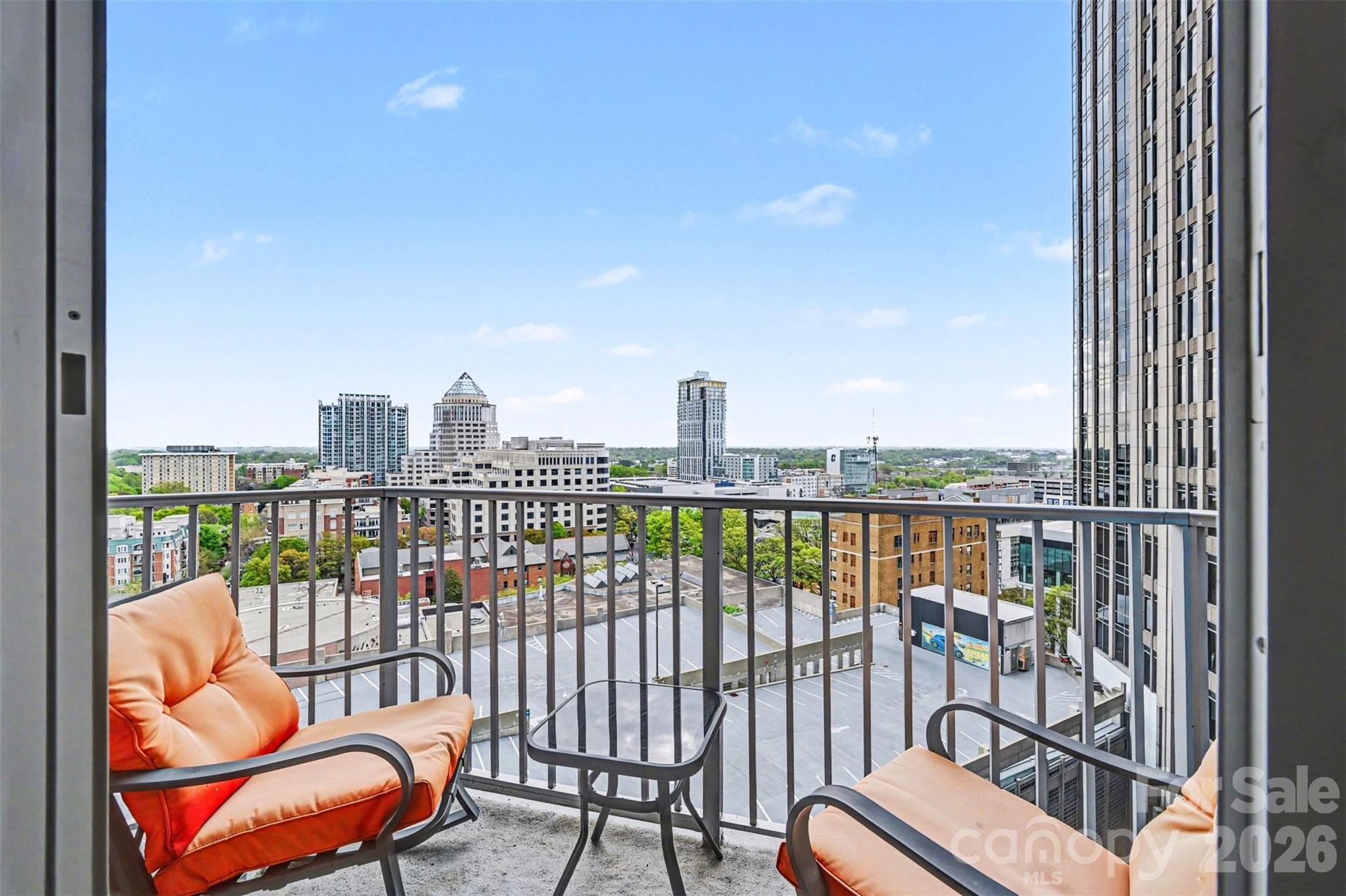 Experience elevated city living in this sleek high-rise residence located in the heart of Uptown Charlotte. Positioned high above the city streets, this unit offers breathtaking skyline views from a private balcony, creating the perfect backdrop for both relaxing mornings and vibrant evenings overlooking the city.

Inside, the space is thoughtfully designed with a modern, urban aesthetic featuring floor-to-ceiling windows that flood the home with natural light and showcase the surrounding skyline. The open-concept layout seamlessly connects the living, dining, and kitchen areas, creating a stylish and functional environment ideal for both everyday living and entertaining. Clean lines, contemporary finishes, and warm wood flooring add to the refined feel, while the bedroom offers a comfortable retreat with continued city views.

Beyond the residence, the building delivers a true luxury lifestyle with an impressive collection of amenities. Residents enjoy access to a rooftop terrace with lounge areas and fire features, perfect for gathering while taking in panoramic views of Uptown. A resort-style pool provides a relaxing escape, complemented by expansive outdoor seating areas designed for both socializing and unwinding. Inside, a fully equipped fitness center and business center offer convenience for both wellness and productivity, while common lounge spaces provide additional areas to connect and entertain.

Situated in a prime Uptown location, this home places you just steps from Charlotte’s best dining, entertainment, and cultural attractions, offering the ultimate combination of convenience, lifestyle, and skyline living.