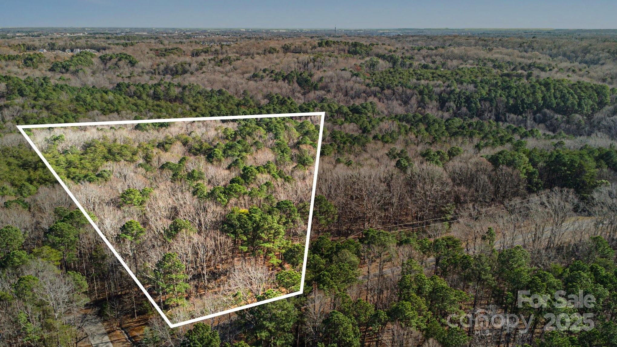 Welcome to this prime wooded homesite with Southern charm and exceptional privacy in The Sanctuary on Lake Wylie. This rare 7.36-acre parcel presents a unique opportunity to build your custom estate in one of Charlotte’s most coveted settings. A septic permit approved for up to 5 bedrooms is already in place, streamlining the process toward your dream home. Enjoy the benefits of community amenities, including miles of scenic trails and shoreline access, while being conveniently located near Steele Creek, shopping, dining, and Uptown Charlotte. With mature trees offering serene seclusion and a paved road frontage, this homesite strikes the perfect balance of privacy and accessibility. Ideal for buyers seeking acreage in a premier location with flexibility for a bespoke build. Don’t miss this exceptional offering in The Sanctuary - ready to become your personal retreat!