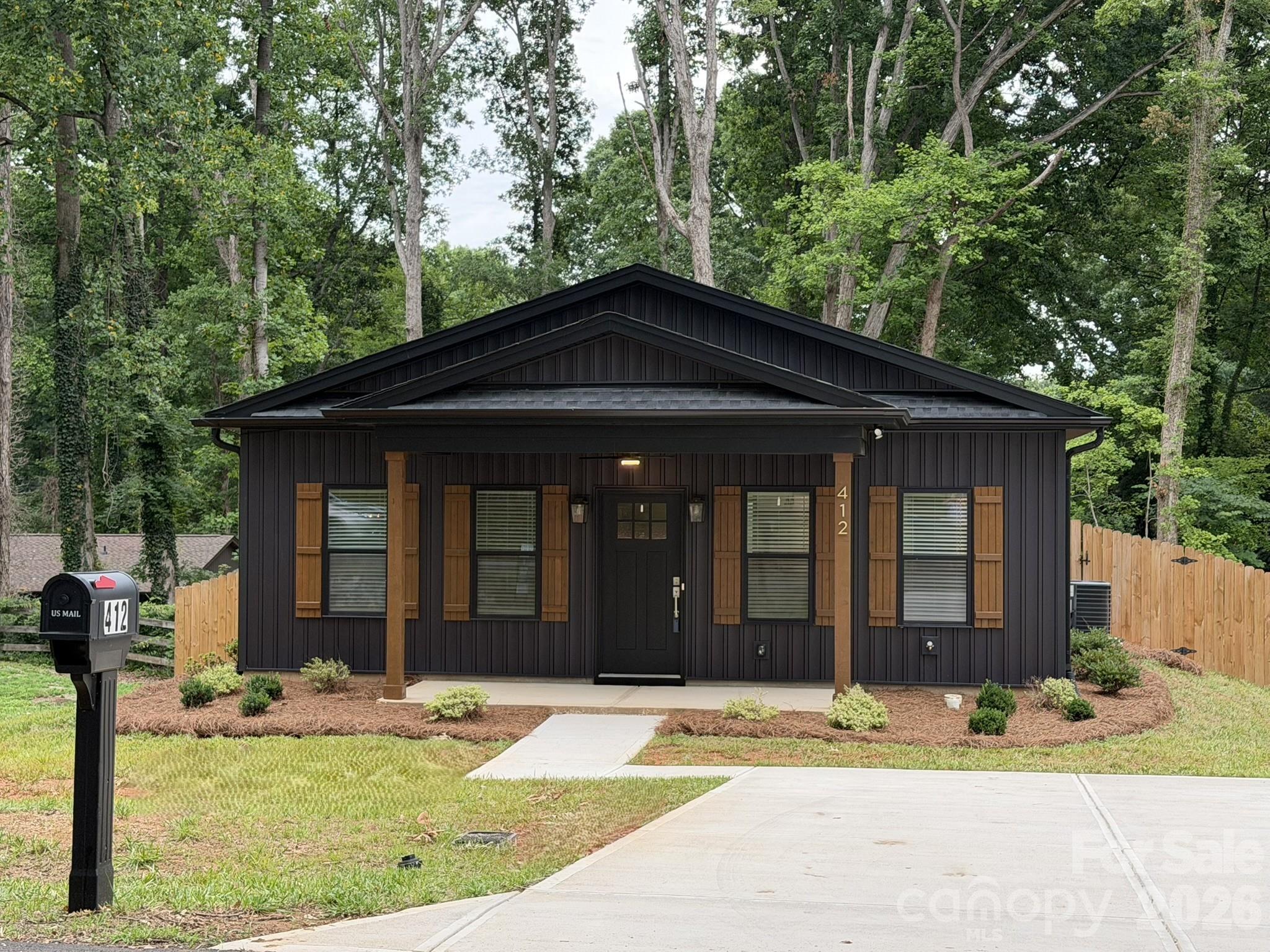 Like new ranch style Dimmer & Sons construction owned by builder. It has been cared for by a tenant for 1 year, and now ready for a new owner. Freshly painted interior and professionally cleaned, so home feels like new again. Wide rocking chair front porch (16'x6') greets you as you step into the open living area with laminate wood look floors. Down the hall you'll find the primary bedroom on the left with a spacious walk-in closet with tiled shower, glass shower doors, tiled floor, granite counter top, and linen closet. For privacy, the 2nd bedroom is on the right side of the hall with a double door closet. The hall bath has a granite topped vanity, tile floor, and tub/shower combo. Kitchen features stainless steel appliances, including a refrigerator that remains, and granite countertops and tiled backsplash. Adjacent to the kitchen is the laundry room with washer/dryer hook-ups. Back door opens to a 12'x12' patio and a huge privacy-fenced back yard that backs to the woods. Foundation survey on file showing approximately .22 acre lot 150 feet deep. Double width concrete drive.