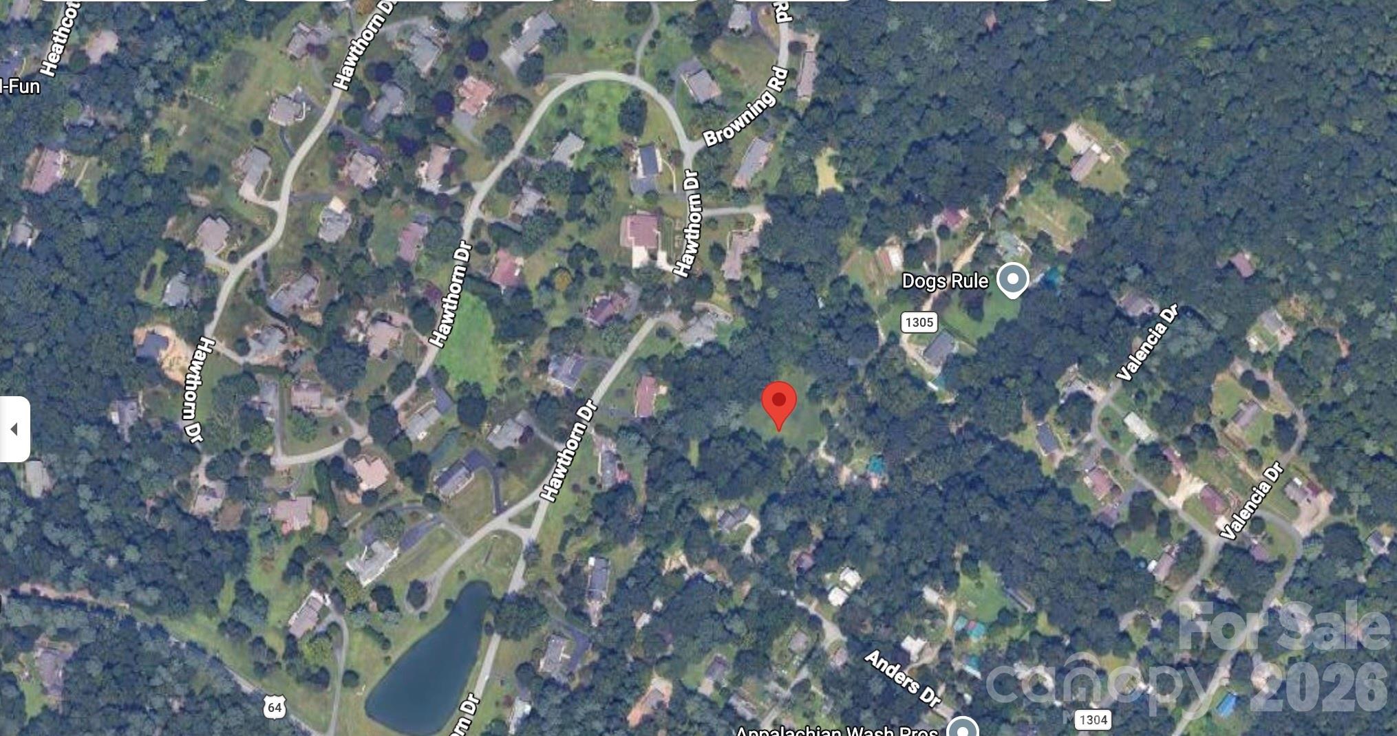 Beautiful, peaceful, private setting. This homesite offers the perfect canvas - a level lot to build your dream home. while keeping you close to everything that makes Western North Carolina so special. Enjoy easy access to charming downtown Hendersonville, scenic biking trails, waterfalls, parks, breweries, and endless outdoor adventures. Whether you are ready to build now or invest for the future, this exceptional lot offers the best of both worlds: tranquility at home with convenience to countless local attractions. Buyer to verify soil suitability and obtain required permits.