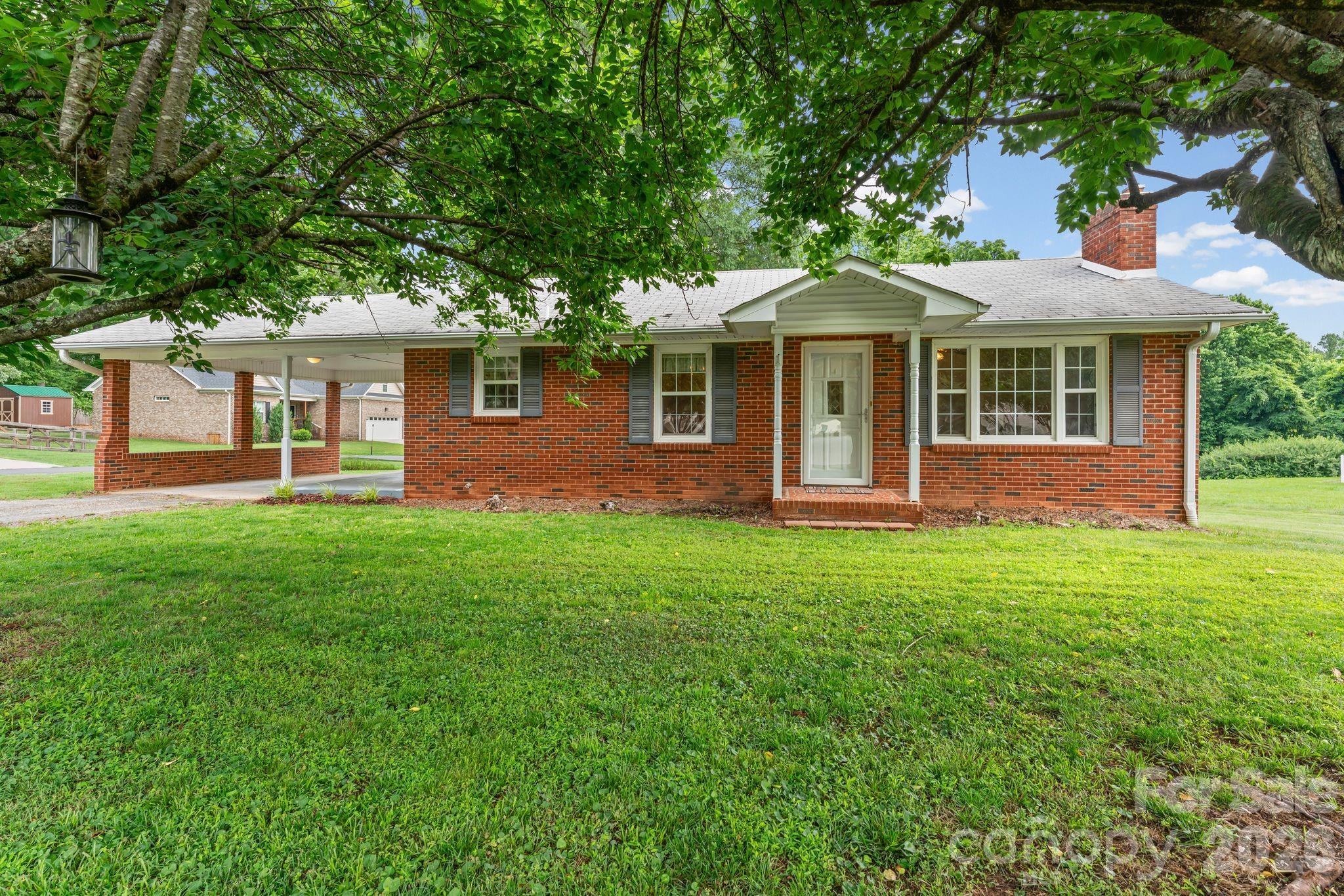 Move in ready brick ranch in the heart of Mocksville! This well maintained 2-bedroom, 1 bath home offers the perfect blend of comfort, convenience, and functionality. Located just minutes from downtown Mocksville, shopping, dining, and schools, you’ll love the ease of being close to everything while enjoying a quiet, established neighborhood with great neighbors. The home features a spacious layout, stainless steel appliances, and a full basement that has served as an ideal home gym and stays comfortable year-round. A standout feature is the oversized detached garage with space for up to 4 vehicles, making it perfect for car enthusiasts, hobbyists, storage, or a workshop. Situated on a generous lot, this property has been exceptionally low maintenance for the current owners over the past 8 years. Whether you’re a first-time buyer, downsizing, or looking for extra garage and storage space, this Mocksville home is a must see!