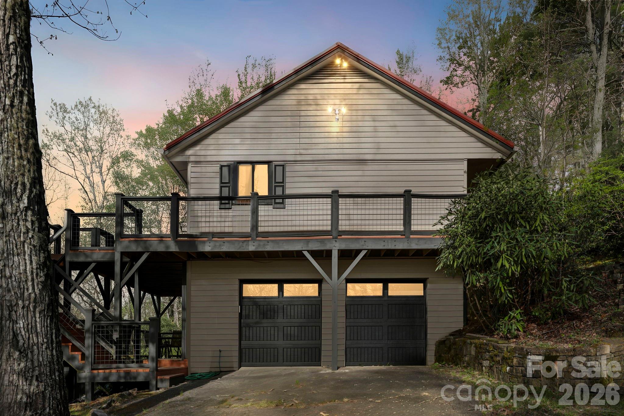 Welcome to this inviting 3 bedroom, 2.5 bath home located in the desirable Rocky Mountain Estates.  Perfectly positioned in the heart of lake Toxaway, this property offers wide open and long range year round views of the breathtaking Blue Ridge Mountains right from your back deck. Step inside to a comfortable and functional layout designed for everyday living and relaxing mountain getaways.  The features include a bright living area, spacious bedrooms, and a welcoming atmosphere that makes it easy to unwind and enjoy the natural beauty surrounding you. The full basement with garage provides excellent storage, recreation room, workshop potential, or room to expand ideal for full time living, a second home or investment property.  Enjoy cool mountain breezes, stunning sunsets, and the tranquility that comes with life in Western North Carolina, all while being just minutes from outdoor recreation, hiking and the natural beauty that defines the Pisgah National Forest and Gorges State Park.
