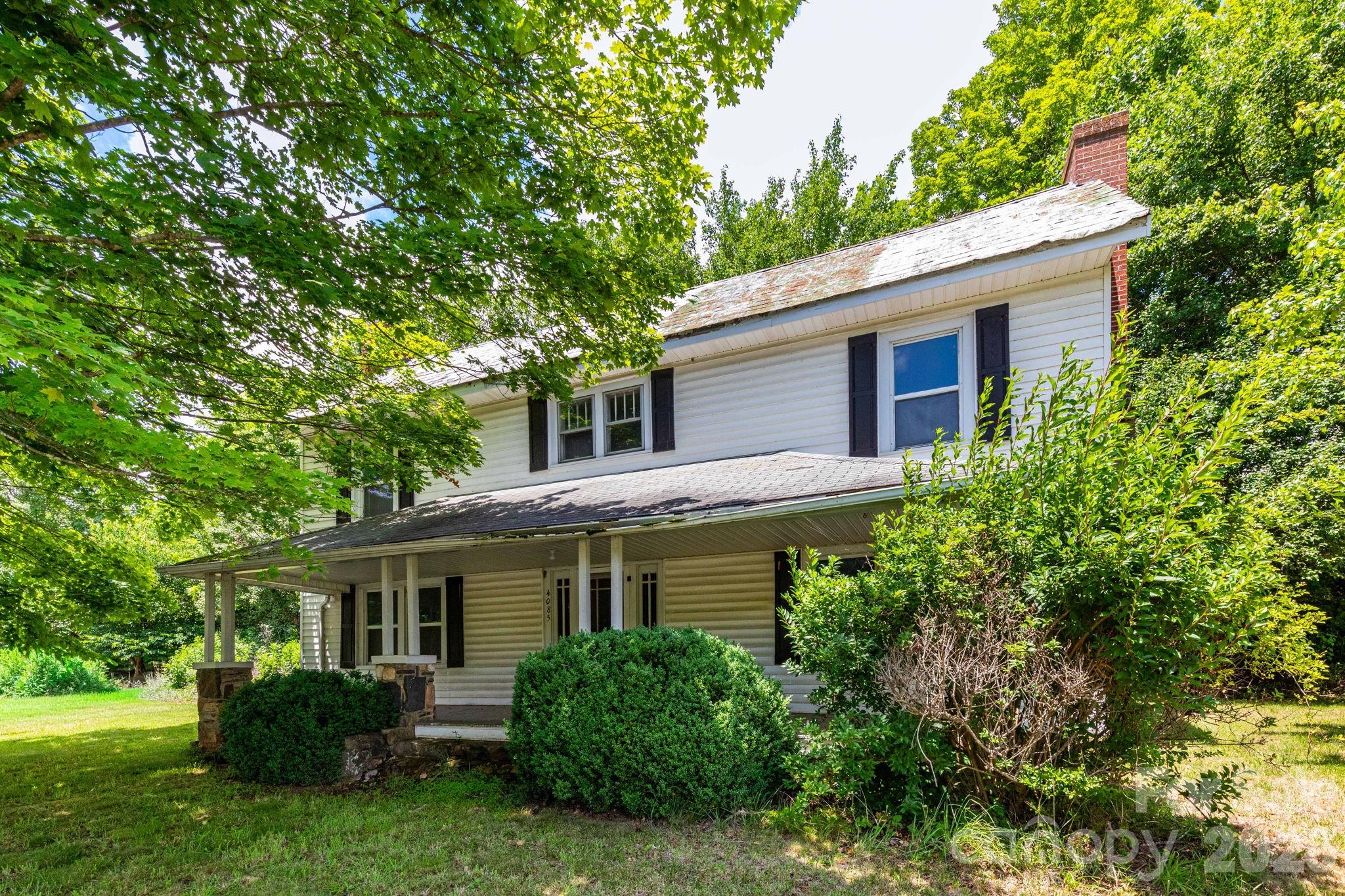 Step back in time with this grand country home, believed to have been built circa 1899 and originally serving as a schoolhouse for the surrounding community. Rich with history and character, the home features soaring ceilings, spacious rooms, abundant natural light, and a large covered front porch overlooking rolling farmland and beautiful mountain views.

Situated in a peaceful rural setting just 15 minutes from town, this property offers a rare opportunity for someone with vision to restore a piece of local history. The home requires significant renovation and deferred maintenance and is being sold as-is. Existing monitor heaters and wood stove have been the primary heat sources, and buyers should verify the condition and functionality of all systems. Due to the property's condition, cash buyers are preferred.