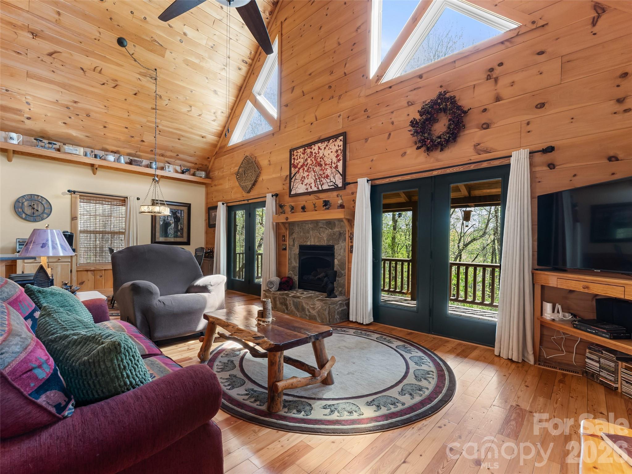 Turnkey mountain home minutes from Saluda, North Carolina. Piney Mountain neighborhood is private, secure and friendly. One level living, with privacy for guests upstairs or down. Home is offered fully furnished with all appliances, pool table downstairs and a generator for extra peace of mind. 
Enjoy privacy and views from the wrap around deck. Enjoy the cozy gas logs and stone fireplace in the living room or a game of pool in the downstairs family room. Property adjoins thousands of protected acres of the NC Gamelands, so you can take a hike right from your property. Only minutes from The Gorge Zipline; Little Bradley Falls; The Wilderness Cove Tubing and the Tryon Equestrian Center. Centrally located within easy reach of downtown Hendersonville; the Asheville Airport area or 35 minutes to Greenville/Spartanburg, SC. Getting away from it all is rarely so convenient.