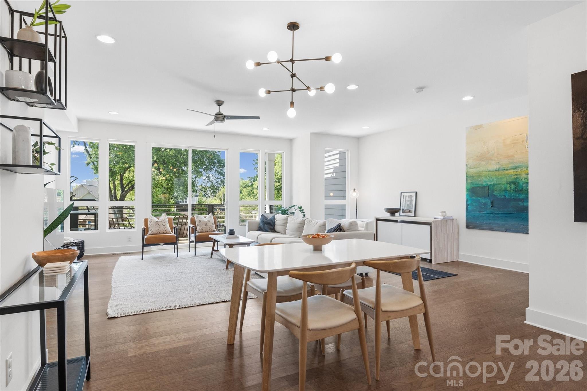 Rooftop terrace, fenced yard, skyline views, and a private 4-unit community in one of Charlotte’s most connected urban neighborhoods! This modern West End townhome delivers the low-maintenance city lifestyle you're searching for - just minutes from Uptown, South End, and the energy of the city, while still offering a true neighborhood feel.

Built in 2020, this move-in ready 3-bedroom, 3.5-bath home offers over 2,300 square feet of thoughtfully designed living space with clean contemporary finishes, abundant natural light, and multiple outdoor living areas rarely found this close to Uptown.

Tucked into the quiet, tree-lined pocket of Wesley Heights, enjoy walkable access to greenways, local favorites like Town Brewing, Rhino Market, and Not Just Coffee, plus the Gold Line streetcar just one block away for effortless city connectivity. Conveniently located just minutes from CLT Airport with easy access to I-77, I-85, and I-277, commuting and travel are seamless.

Inside, the open-concept main level features a spacious living area, oversized kitchen island, stainless steel appliances, gas range, and modern cabinetry designed for both everyday living and entertaining. A flexible lower-level suite creates the perfect setup for guests, a home office, gym, or roommate-style living.

Upstairs, the spacious primary suite offers a large walk-in closet, dual vanity, and direct access to a private terrace with skyline views. Additional features include a full-size laundry room, ample storage, and a 2-car garage.

Outdoor living truly sets this home apart - with a fenced backyard, multiple terraces, and a rooftop terrace designed for entertaining, relaxing, and taking in unforgettable sunset views over the city.

Modern construction, functional space, rare outdoor living, and unbeatable proximity to Uptown - this is city living without compromise!