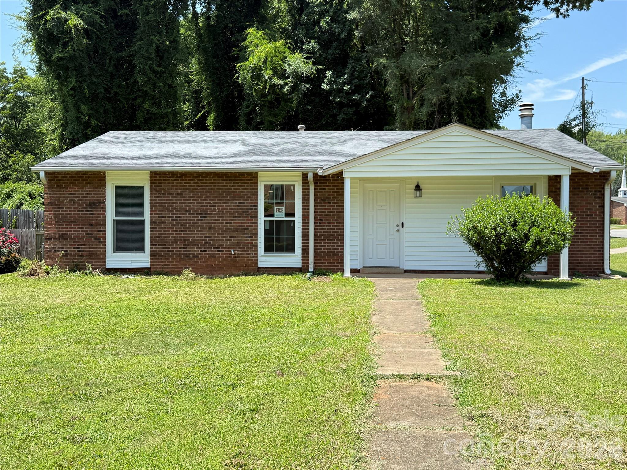 Newly renovated transitional home tucked away in Charlotte's established Tanglewood community. Perfect for first-time homebuyers, downsizers, or investors seeking a high-demand rental, this property blends classic character with incredible modern potential. 
Located in the heart of the fast-growing 28269 area, you are just minutes away from local parks, popular eateries, and daily shopping conveniences. Commuting is a breeze with quick, direct access to I-85, I-77, and W.T. Harris Blvd, putting UNC Charlotte, the LYNX Light Rail, and Uptown Charlotte practically at your doorstep.

Step into a welcoming Great Room featuring impressive vaulted ceilings and a cozy central fireplace—making the space feel incredibly open, airy, and bright. Convenient Main-Level Living.
Spacious lot is a fantastic canvas for gardening, weekend BBQs, or creating a pet-friendly retreat.

**Virtual Staging pictures for reference only**