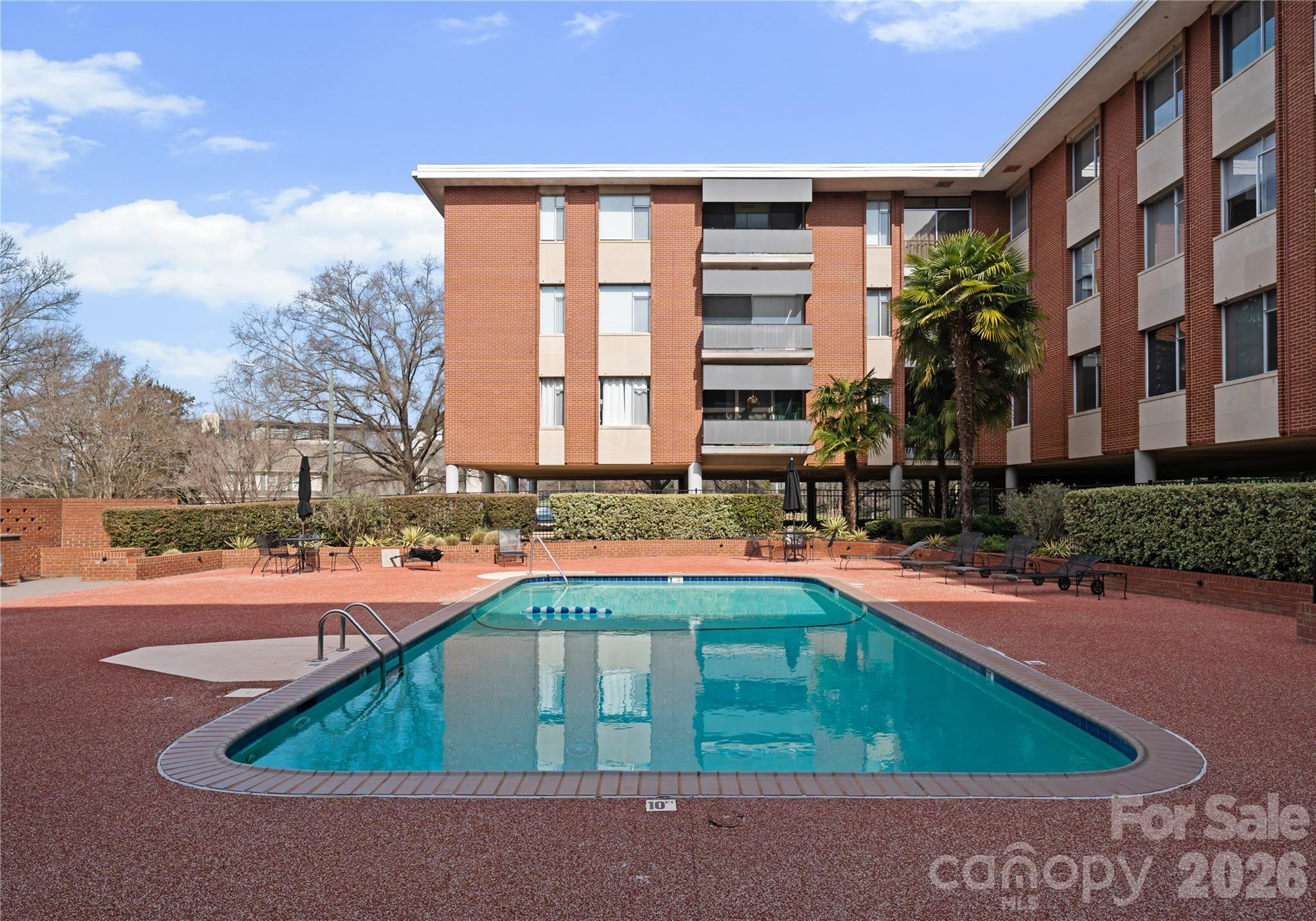 Welcome to one of the most sought after addresses in Myers Park, 1300 Queens Road is an architectural masterpiece situated along tree lined streets. A secure and private entry into a sleek lobby welcomes you and your guest. Upon entry into the residence spanning over 2,400 square feet one will discover a modern interior graced with views of the Charlotte skyline. 
Highlights: 
Wine refrigerator 
Fireplace 
2 balconies 
Primary bathroom with marble and walk-in shower
Washer and Dryer in the unit which is rare for this building. Most units use community laundry room in basement.
3rd floor 
2 Covered Designated parking spaces
Most furniture available for purchase with sale of condo.
Experience the tranquility of Myers Park from sunrise to sunset in your new home. Walk to boutique shops, grocery, restaurants, and Freedom Park.