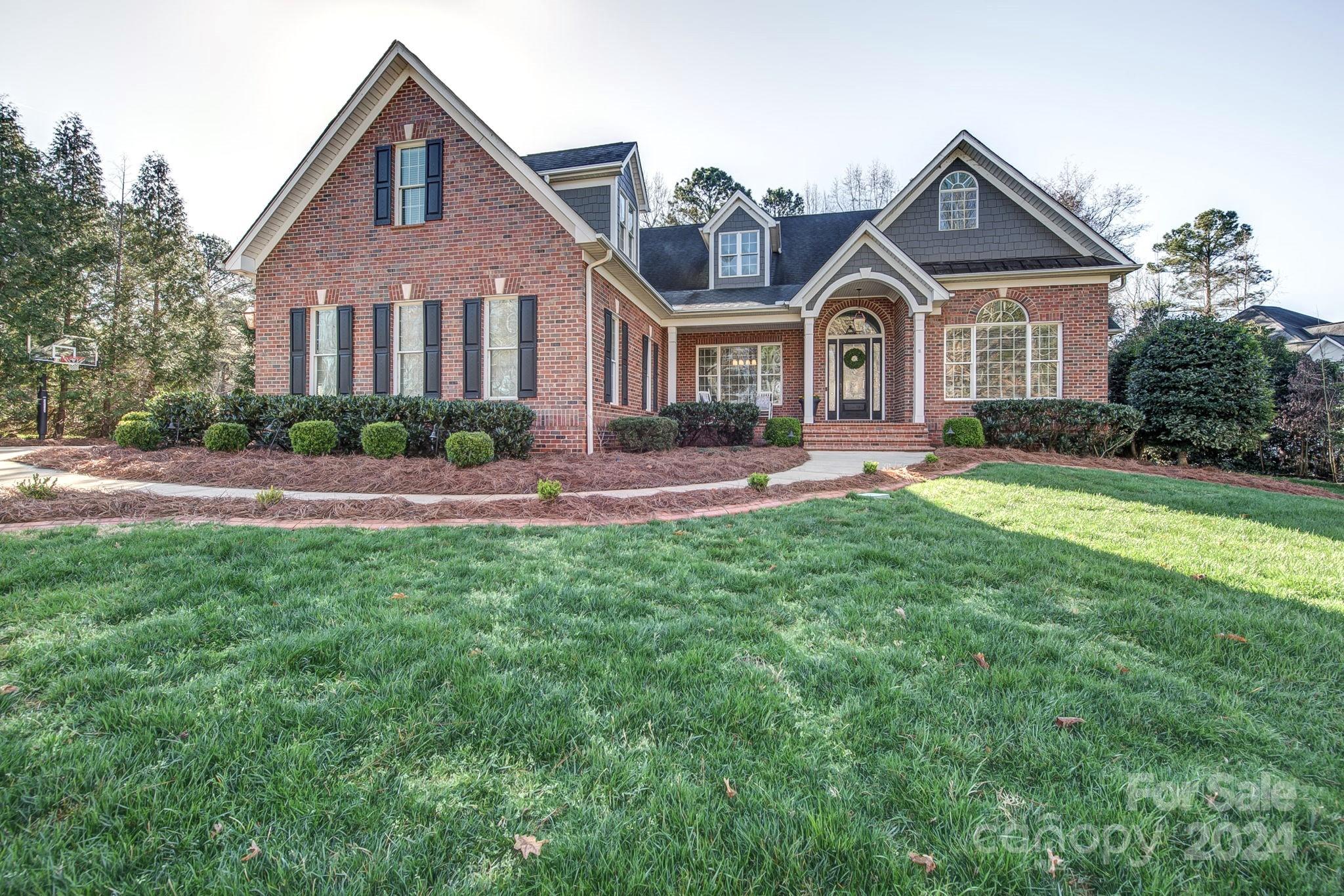 Gorgeous home in desirable Misty Waters with water access and large 1.13 acre lot!  This stunning home offers over 4600 sq ft of living space & wonderful outdoor living areas. The main level features a beautiful great room with fireplace, dining room, home office & spacious sun room that will be your favorite spot in the house. Kitchen with gas cook top, wall oven, walk in pantry, island, breakfast area & adjoining keeping room w/fireplace. The primary suite has hardwood floors, His/Her closets, soaking tub, walk in shower & His/Her vanities. Two additional bedrooms share a Jack & Jill bath each with a private vanity. The upper level offers plenty of room to entertain, work or relax. Large bonus room that could be 4th bedroom has adjacent closet & full bath. Flex rooms for exercise, offices or craft rooms. Enjoy movie night in the cozy media room. Deeded boat slip & hot tub convey. Private gated community minutes to Downtown Belmont and short commute to Uptown Charlotte & Airport.