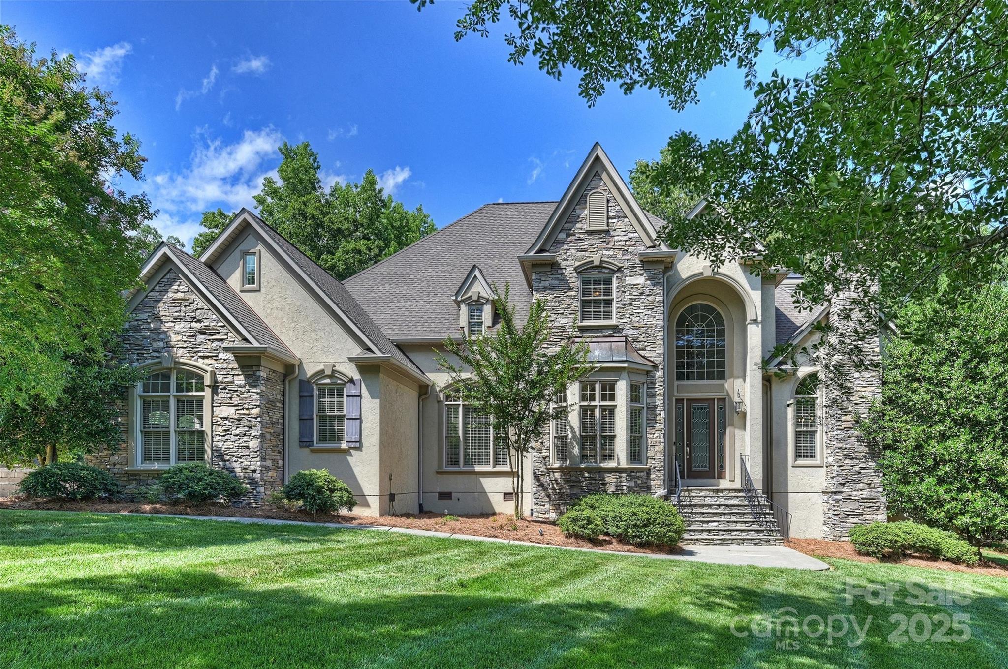 Ready to live in a custom luxury home just 10 minutes from Downtown Waxhaw and one mile from top-rated Indian Land High School?

Now $1,049,000 — a $126,000 reduction!
Best Value in Millstone Creek.

Set on a private, wooded acre with a creek, this 4,912 sq. ft. home blends comfort and elegance. Imagine designing your dream backyard oasis — pool, outdoor kitchen, fire pit — all framed by a wrap-around back porch, pergola, and natural privacy.

Inside, you’ll find tasteful finishes, dual staircases, and multiple living areas.

Main-floor Primary Suite with spa bath, sitting area, and custom closet.

Gourmet Kitchen with granite, stainless appliances, and sunny dining nook.

Great Room + Billiards Room, each with a fireplace.

Office for work-from-home convenience.

Upstairs: 3 bedrooms, 2 bonus rooms (one large enough for a 5th BR, media, or gym), plus a loft for added flexibility.

Millstone Creek offers peaceful living in the Lancaster Panhandle, yet minutes from Indian Land, Fort Mill, Ballantyne, and Waxhaw.

Highlights You’ll Love:

4 BR | 3.5 Baths | 2 Bonus Rooms + Loft.

Main-floor Primary Suite.

Nearly 5,000 sq. ft. of versatile living space.

Private 1-acre lot with wooded backdrop & creek.

Wrap-around porch, pergola, hot tub, and perfect pool site.

If you’ve been searching for luxury and value, this is the home. Customize your backyard retreat with your $126,000 in savings.