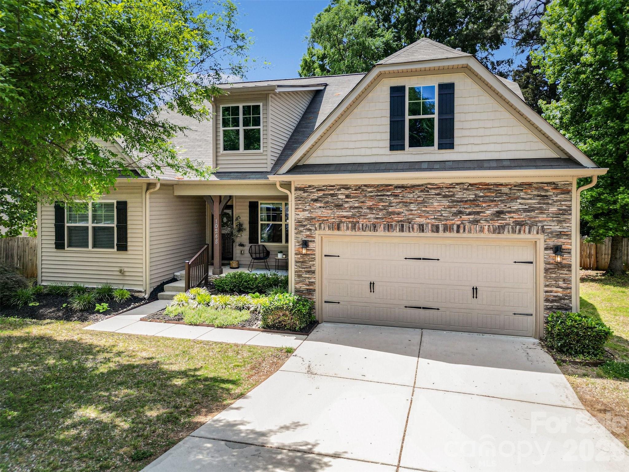 Tucked away in the desirable Riverwood community, this beautifully maintained home offers the perfect blend of comfort, style, and connection to nature in one of Charlotte’s most sought-after lake-access neighborhoods. This 4-bedroom, 3-bath home welcomes you with charming curb appeal, a covered front porch, and bright, inviting interiors filled with natural light.
Inside, layout is designed for both everyday living and entertaining. The spacious living room features custom built-ins surrounding a cozy fireplace and flows seamlessly into the kitchen and dining areas. The kitchen serves as the heart of the home with a large center island, warm cabinetry, modern finishes, and an effortless connection to the main living spaces. 
The main-level primary suite offers a relaxing retreat with a spa-inspired bath featuring dual vanities, a soaking tub, and a walk-in shower. Additional bedrooms provide flexibility for guests, office space, or hobbies, while the upstairs loft creates the perfect bonus area for a media room, playroom, or second living space.
Step outside to enjoy a peaceful backyard setting surrounded by mature trees. The elevated deck offers ample room for grilling, entertaining, or simply unwinding while enjoying the privacy and natural views. 
Riverwood residents enjoy lake access and a tranquil atmosphere while remaining conveniently close to shopping, dining, and recreation.This location perfectly balances peaceful living with city convenience.