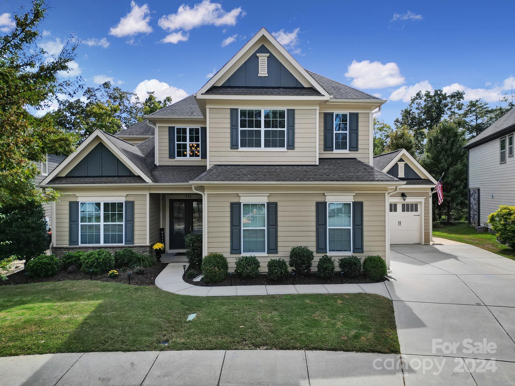 This beautifully crafted stone-accented home is located within the highly regarded Fort Mill School District! This home invites you to enjoy an expansive screened-in porch with privacy curtains and a TV mount, leading to a stunning paver patio complete with a cozy outdoor fireplace. Perfect for entertaining or relaxing! Inside, you'll find custom cabinetry, rich hardwoods throughout the main level, and an open floor plan. The main-level primary suite features a spacious dual vanity, a tiled shower, and a luxurious soaking tub. A gourmet kitchen awaits with a gas cooktop, wall oven, built-in microwave, and a butler's pantry equipped with a wine cooler. Additional features include a guest suite on the main floor, a functional drop zone, a computer niche, and a full laundry room with a sink. Upstairs, a generous bonus room offers extra living space. The Brayden community provides top-notch amenities such as a clubhouse, pool, walking trails, and recreational areas.