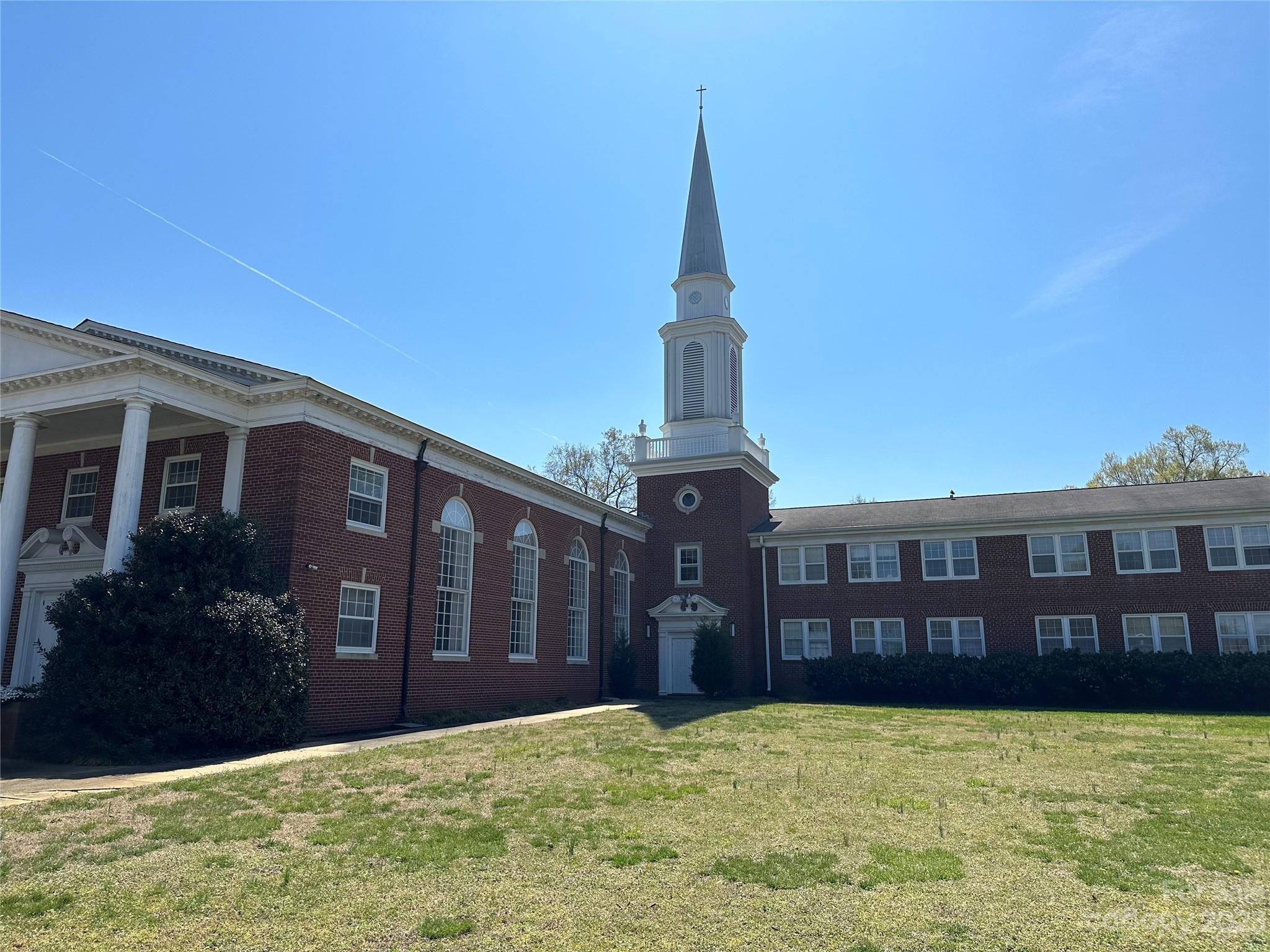 18000 Sq/ft on two acres in the heart of downtown Mooresville! Property is located one block away from Mooresville High School, Mooresville Government Center and Liberty Village which is currently under construction. Mooresville ARP is merging with another local church and will no longer need the property. Property includes two buildings. The Sanctuary Building includes a traditional Sanctuary, Fellowship hall, Kitchen and many office/ meeting rooms. The Family Life Center has a huge multi-purpose room with retractable basketball goals, Two office areas and a fully equipped Commercial grade kitchen that rivals many restaurants. Please see attachments for measurements and floor plans. This is an agent accompanied showing.