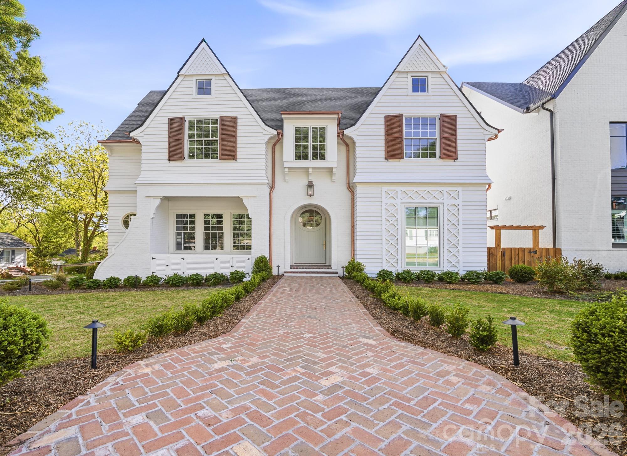 Just completed in the heart of Davidson and moments from acclaimed dining, boutiques & cultural events, a custom Patrick Joseph Designer Home residence blends timeless sophistication with modern ease. A chef’s kitchen with scullery, walk-in pantry & expansive island flows into the family room anchored by a gas fireplace. The main level hosts a serene primary suite while the upper level unveils a media lounge designed for elevated entertaining—complete with a built-in bar and beverage/wine fridge. A playroom, private office & four ensuite bedrooms with walk-in closets complete the floor. Thoughtful conveniences include laundry on both levels. Outdoors, bluestone porches & a covered patio with built-in grill area are framed by professional high-design landscaping with irrigation. With 8’ solid-core doors, engineered wood floors & curated appliances, this offering captures luxury living in Davidson’s most coveted setting. No HOA.