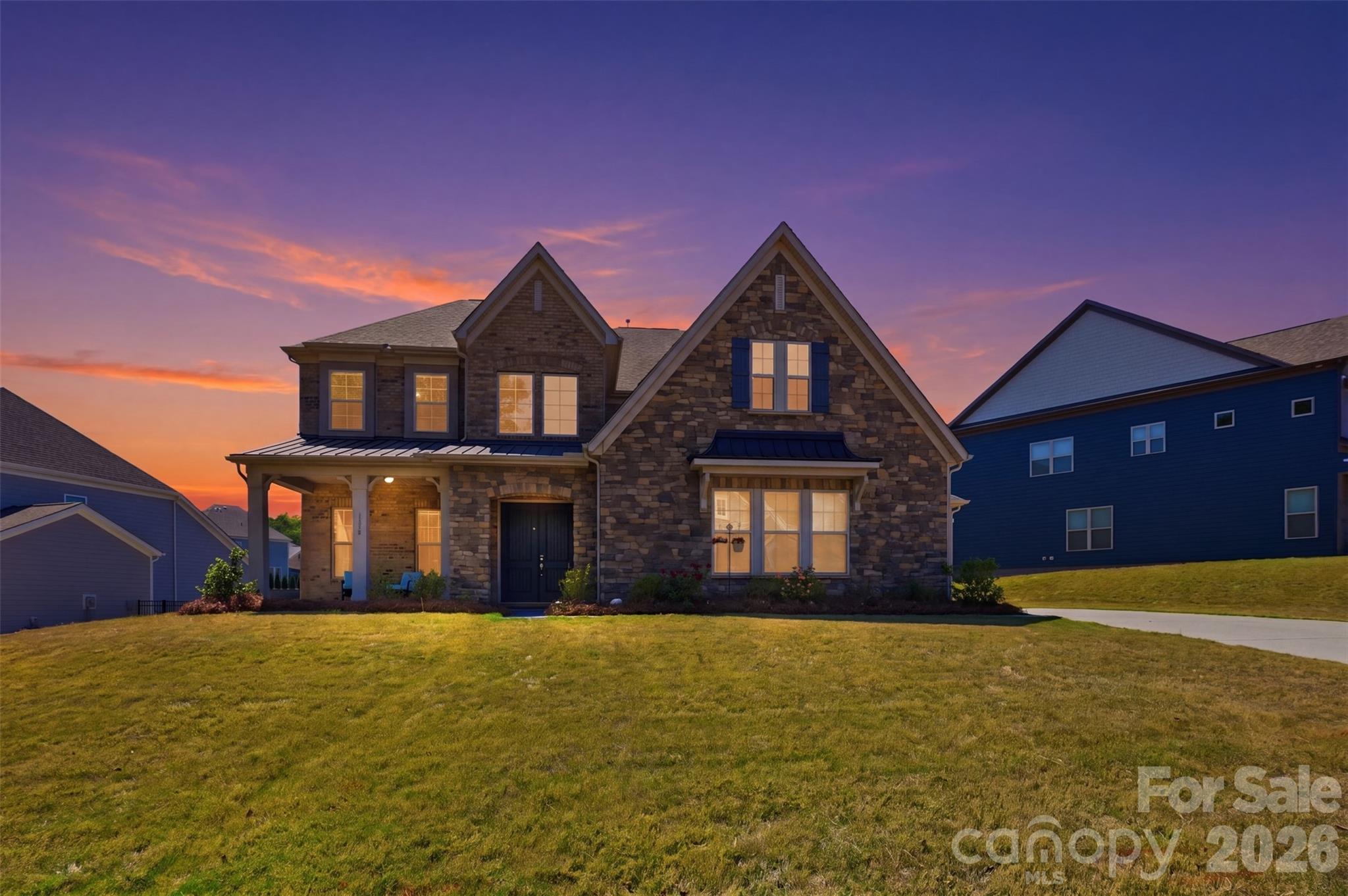Rare opportunity in highly desirable Indian Land! This stunning 5-bedroom, 4.5-bath home offers over 4,600 square feet of beautifully designed living space on a spacious 1/3-acre lot perfectly blending luxury, functionality, and location.

Ideally situated just minutes from the North Carolina border and Ballantyne, you’ll enjoy unbeatable convenience paired with the benefit of low South Carolina taxes.

Inside, you’re greeted by soaring 10-foot ceilings, exposed beams, and an open, inviting floor plan designed for both everyday living and entertaining. The chef’s kitchen is the heart of the home, featuring high-end finishes, ample workspace, and seamless flow into the main living areas.

A standout feature is the private multi-generational suite on the main level ideal for guests, extended family, or a private home office setup.

Upstairs and throughout, you’ll find generously sized bedrooms, well-appointed baths, and plenty of space for relaxation, work, and play.

Located within the highly rated Indian Land school district, this home truly checks every box—space, style, and an unbeatable location.