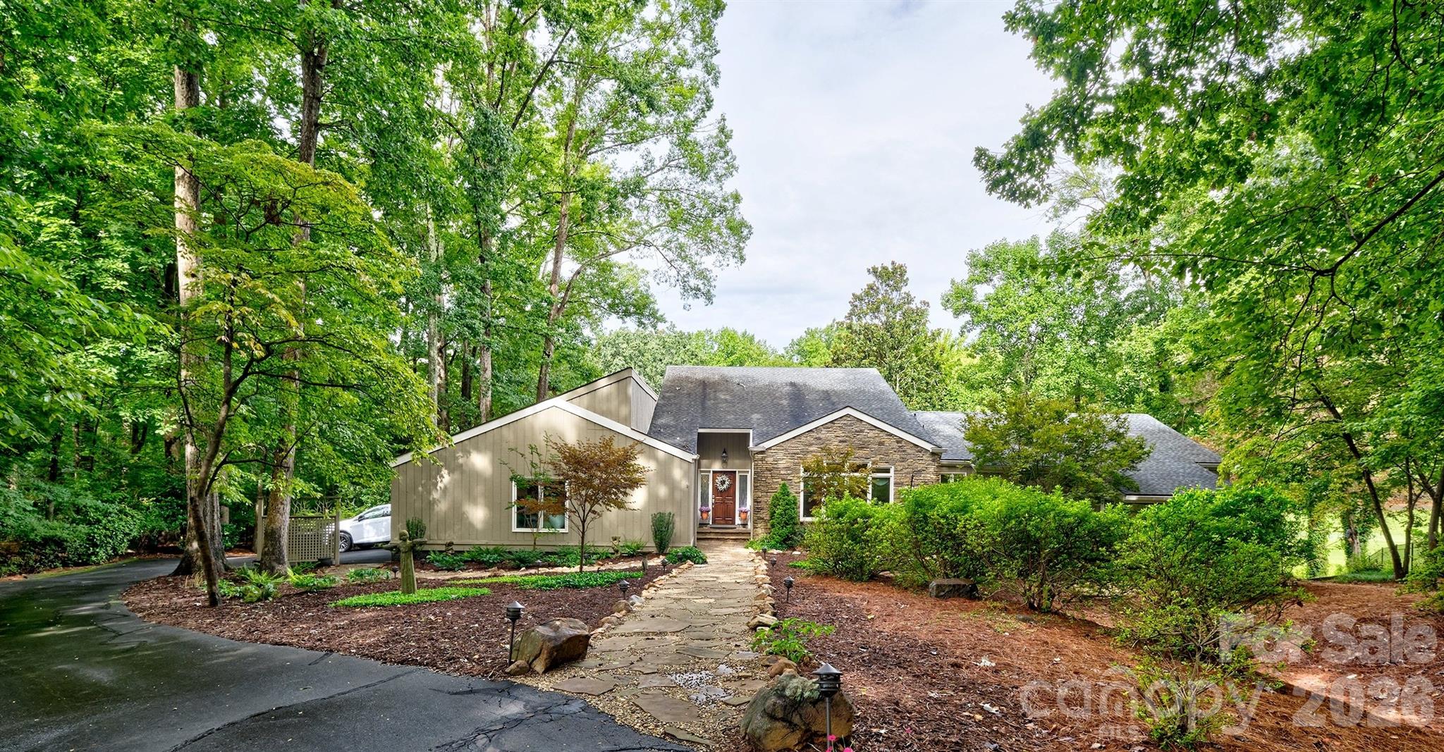 AMAZING RANCH/1 STORY RENOVATED, UPDATED AND WOW REMODELED HOME ON THE 13TH TEE BOX OF THE RIVER HILLS COUNTRY CLUB IN LAKE WYLIE,SC.  SOARING CEILINGS AND 130 YEAR OLD TIMBERS FROM A TEXTILE MILL PURCHASED AND INSTALLED BY THE ORIGINAL OWNER/BUILDER OF THIS HOME.  SERIOUS WOW FACTOR!  3 BEDROOMS, 2 1/2 BATHS, OVERSIZED (.53 ACRE) AND PRIVATE LOT AND WINDING DRIVEWAY THAT CREATES QUITE THE ENTRY AND SETS OFF THE BEAUTIFULLY LANDSCAPED NATURAL YARD.  SELLERS HAVE UPGRADED THE ELECTRICAL, INSTALLED NEW RETAINING WALL & GRADING, PUT IN MOTORIZED BLINDS ACROSS THE BACK OF THE HOME, INSTALLED ALL NEW GUTTERS, NEW WINDOWS AND SO MUCH MORE SINCE THEY HAVE OWNED THIS 1.  THE KITCHEN IS INCREDIBLE AND SO MUCH ROOM TO WORK WITH AND MORE CABINETS TO CREATE MEMORIES COOKING AND ENTERTAINING.  2 CAR GARAGE WITH NEW EPOXY FLOOR AND A 4 SEASON ROOM THAT IS HEATED AND COOLED AND BRINGS IN ALL THE NATURAL LIGHT AND STILL COZY!  DONT MISS THE OFFICE OFF THE MASTER !  HUGE WALK IN CRAWL SPACE AND STORAGE UNDER THE HOUSE TO STORE ALL YOUR TOYS FOR THE LAKE!  SELLERS OFFERING CONCESSIONS TO BUY DOWN RATE!  WHAT IS NOT TO LOVE??  RIVER HILLS NEIGHBORHOOD OFFERS MILES OF WALKING TRAILS, MARINA, COUNTRY CLUB W/ 2 POOLS AND CLUBHOUSE, GARDENS, PLAYGROUNDS AND A WATERFRONT PARK WITH SANDY BEACH AND VIEWS FOR MILES.  AND IN THE AWARD WINNING CLOVER SCHOOL DISTRICT !!  ZONED FOR THE NEW LAKE WYLIE HIGH SCHOOL. WELCOME HOME!!