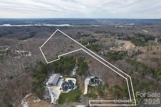 Your Private Sanctuary Awaits: 15-Acre Trinity Church Estate! Imagine a property that offers the rare luxury of absolute seclusion without sacrificing accessibility. This sprawling 14.97-acre private estate is a blank canvas for those who value privacy, legacy, and the great outdoors. Accessed with an easement off Farmstead Lane to (see plat for right-of-way details), the journey into this property feels like entering a private world away from the noise.

Endless Possibilities Whether you are looking to build a singular architectural masterpiece or a multi-generational retreat, the scale of this acreage provides unparalleled flexibility:

The Ultimate Family Compound: With nearly 15 acres at your disposal, there is ample room to build your estate and an additional dwelling unit. Create a shared sanctuary where family can live close by while still maintaining individual privacy.

Natural Privacy: The acreage acts as a permanent buffer, ensuring your views and your peace remain undisturbed.

Development Details
Acreage: 14.97 gross acres.

Utilities: Currently off-grid (no city water or sewer), offering the perfect opportunity for a custom well and septic system tailored to your specific build.

Soil Status: A professional perk test has already been conducted and have been told that the land is suitable for a 5 bedroom dwelling. We are awaiting the official report and will update the listing as soon as the results are in-hand.

This is more than just a plot of land; it’s an opportunity to secure a legacy property in a prime location.