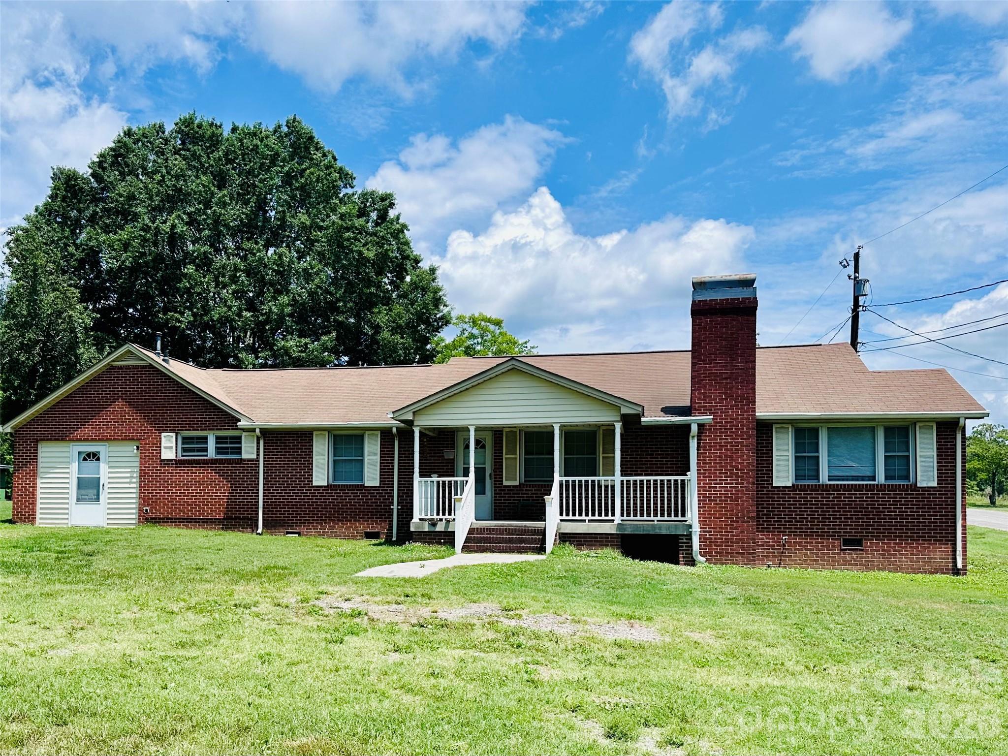 So many possibilities with this solid brick ranch situated on an open 1+ acre lot in a convenient location just off Highway 29 in China Grove. Offering 1800sf, this 3-bedroom, 1-bath home features a spacious eat-in kitchen, large pantry area, living room and a separate family room with fireplace. Generously sized bedrooms, an additional storage/flex room and ample storage throughout provide plenty of possibilities for renovation and customization.

Outside, the property includes a large storage building, two septic systems, and a camper hookup, offering added flexibility for future use. With its desirable lot size, brick construction, and strong potential for value-add improvements, this property is ideal for investors or buyers looking to build equity. 

Property is being sold as-is, with seller making no repairs or removal of remaining contents. Home will require renovations and repairs, offering an opportunity for the next owner to restore, reconfigure, or update the property to suit their needs.